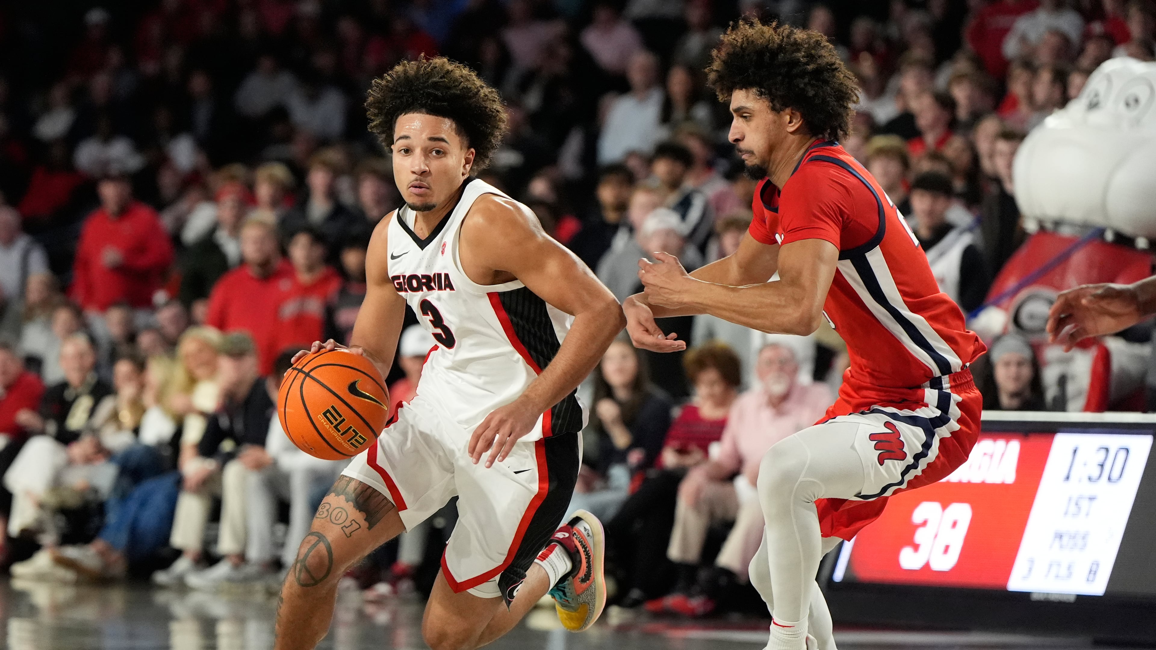 Georgia guard Jordan Ross dribbles the ball against Mississippi guard Patton Pinkins during an NCAA college basketball game, Wednesday, Jan. 14, 2026, in Athens, Ga. Pinkins scored the game-winner as Ole Miss knocked off No. 21 Georgia in overtime, 97-95. (Brynn Anderson/AP)