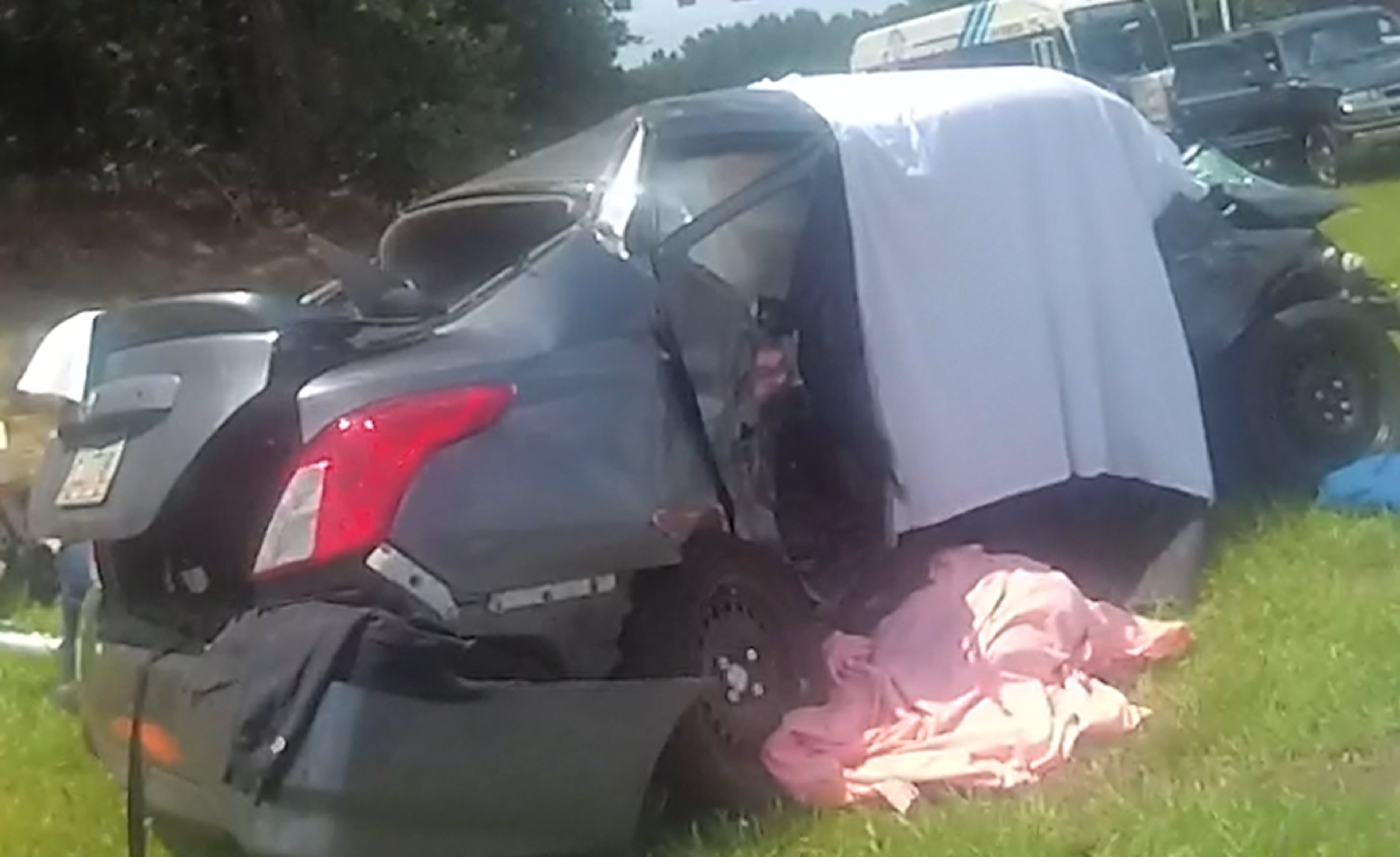 A Nissan Versa driven by Sherita Carter is seen at the crash site in body-camera video from June 2, 2020. (College Park Police Department)