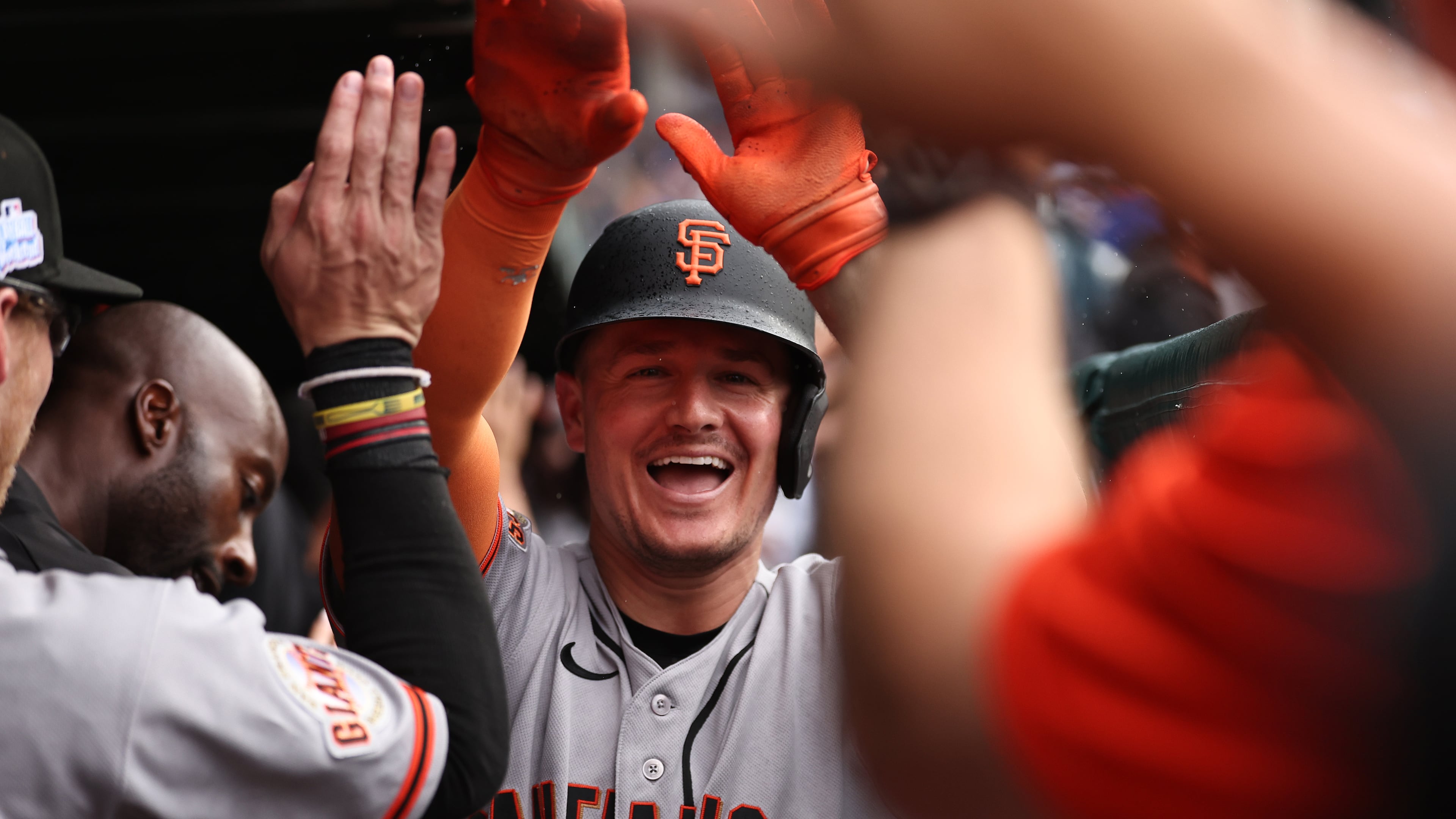The San Francisco Giants' Matt Chapman celebrates in the dugout after hitting a grand slam during the fourth inning of a baseball game against the Chicago Cubs, Friday, June 5, 2026, in Chicago. (AP Photo/Geoff Stellfox)