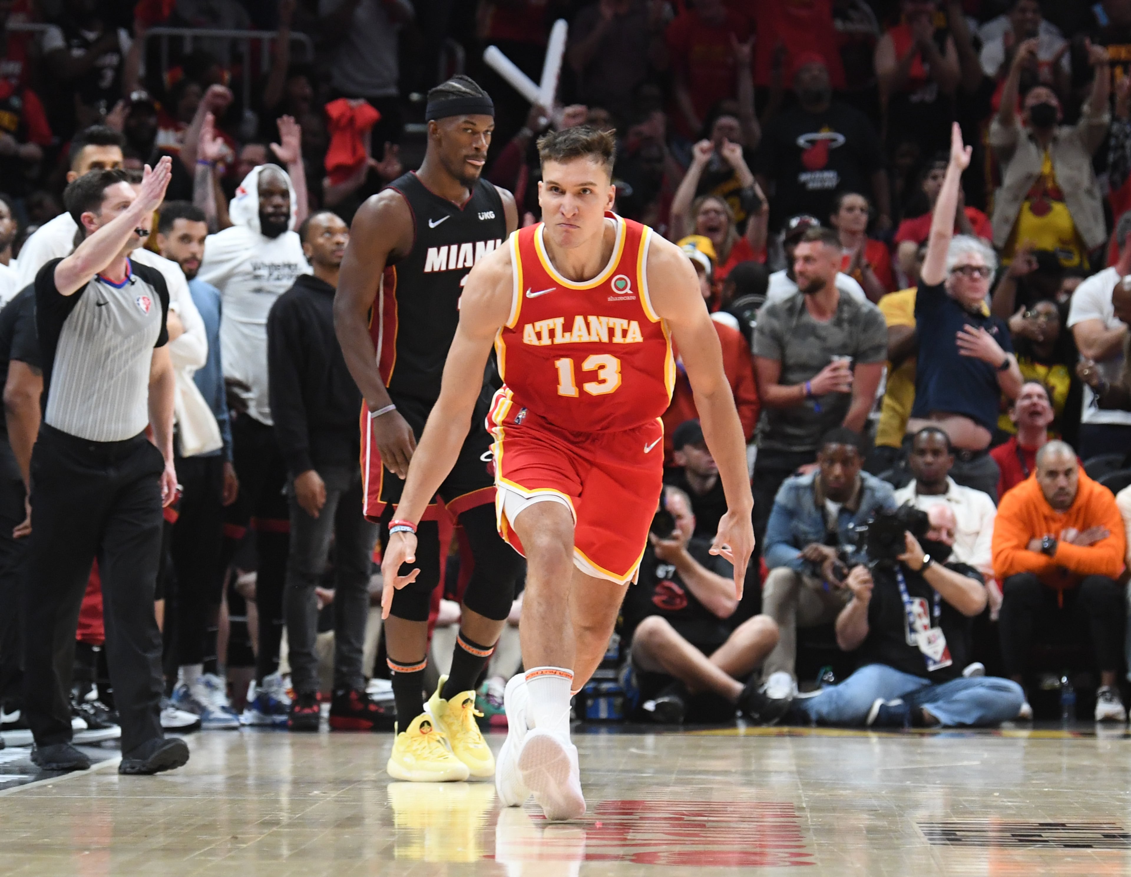 April 22, 2022 Atlanta - Atlanta Hawks' guard Bogdan Bogdanovic (13) celebrates after scoring a 3-point basket during the second half in Game 3 of the first round of the NBA playoffs at State Farm Arena on Friday, April 22, 2022. Atlanta Hawks won 111-110 over Miami Heat. (Hyosub Shin / Hyosub.Shin@ajc.com)