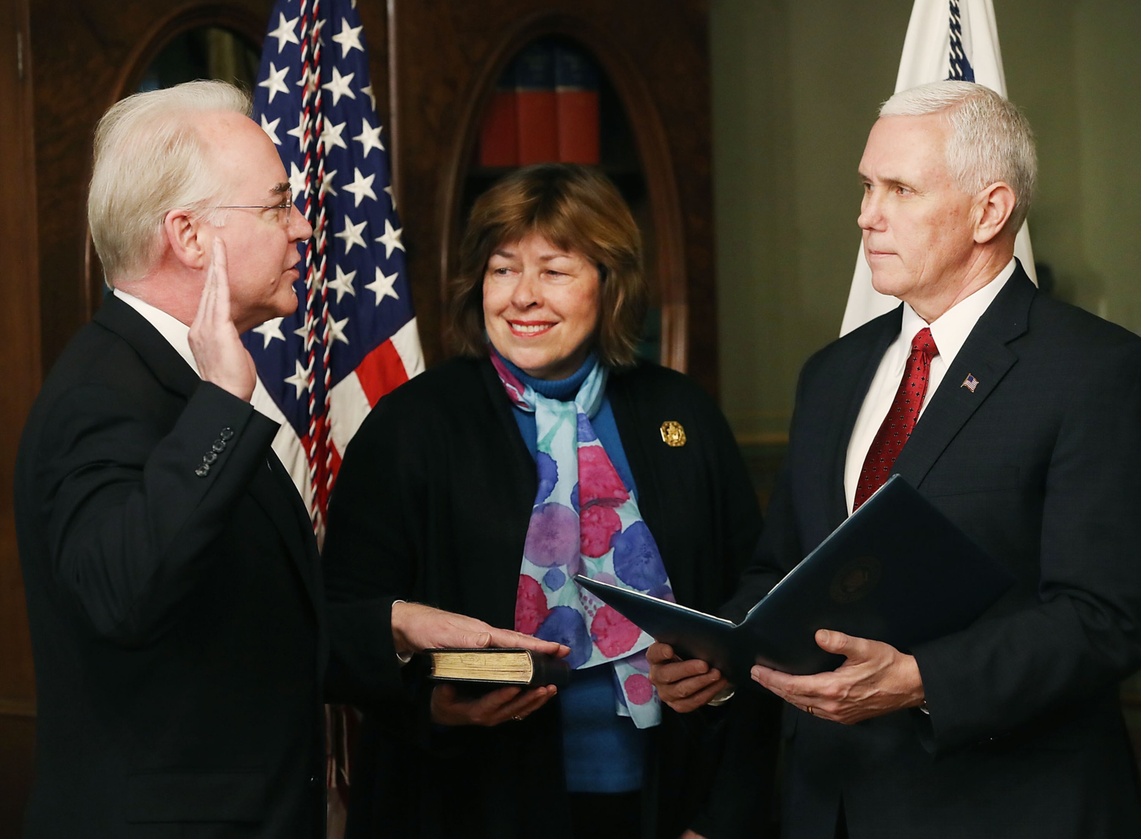 WASHINGTON, DC - FEBRUARY 10: U.S. Vice President Mike Pence (R) swears in Rep. Tom Price (R-GA)(L) as new the Health and Human Services Secretary, as his wife Betty Price holds a bible, on February 10, 2017 in Washington, DC. Yesterday Price was confirmed by the U.S. Senate. (Photo by Mark Wilson/Getty Images) ***BESTPIX***