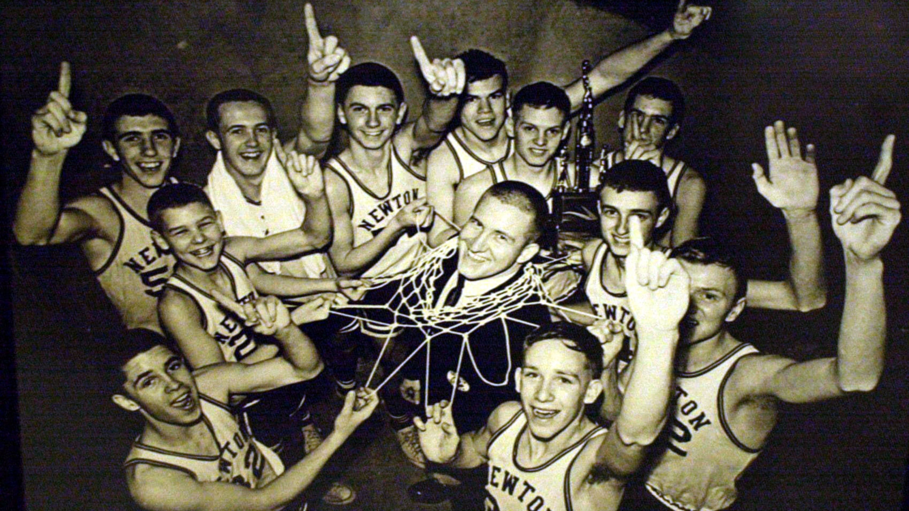 Coach Ronald Bradley stands in the middle of the 1964 Newton County High Schoo championship team. (T. Levette Bagwell/Staff)