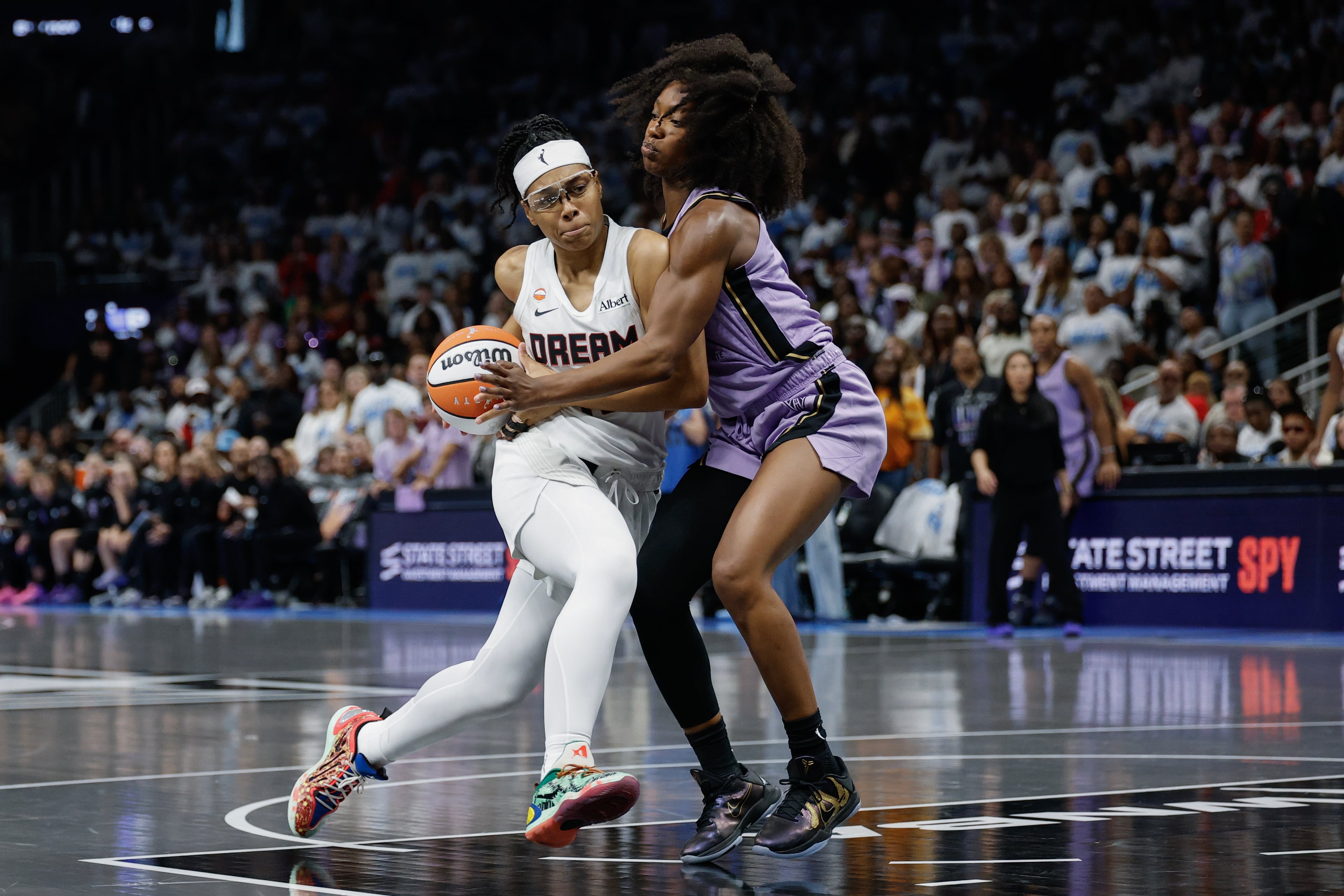 Atlanta Dream guard Allisha Gray drives against Golden State Valkyries guard Kaila Charles during the second half of Game 4 of the WNBA Finals between the Atlanta Dream and the Golden State Valkyries, Saturday, Oct. 24, 2026, in Atlanta. (Erik S. Lesser for the AJC)