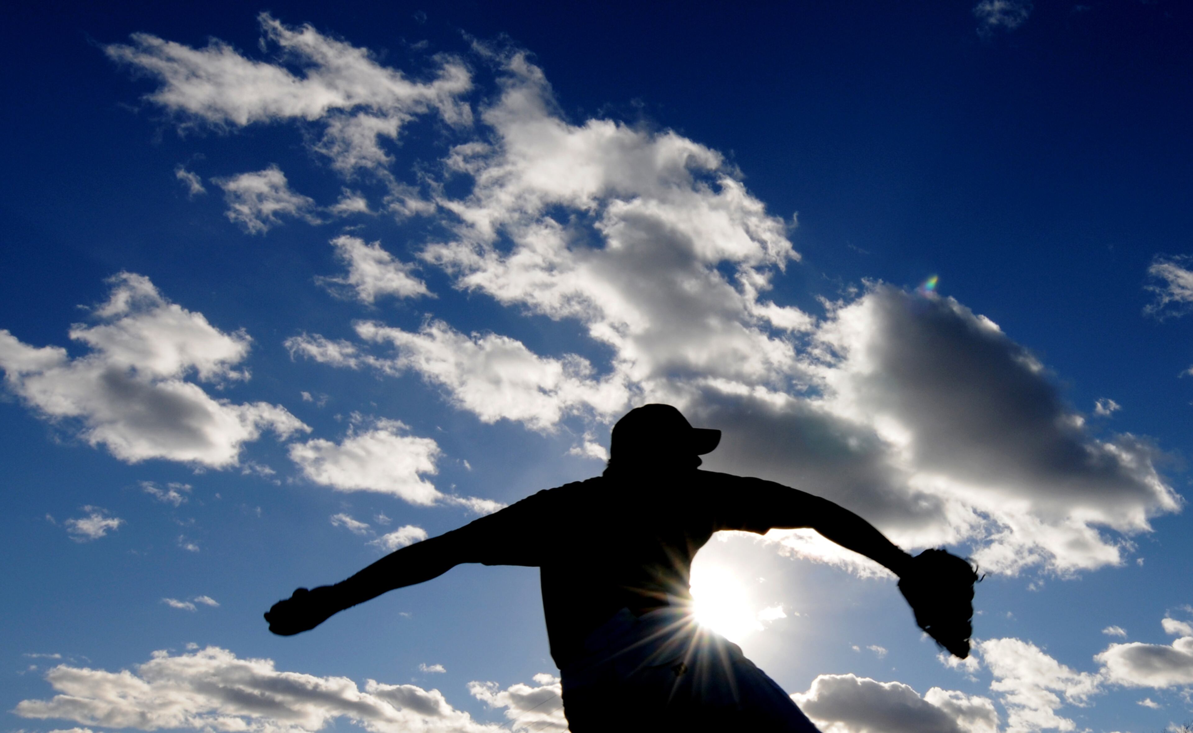 Kansas Wesleyan pitcher Petey Martinez throws the ball during team practice Tuesday, Jan. 14, 2014, in Salina, Kan.