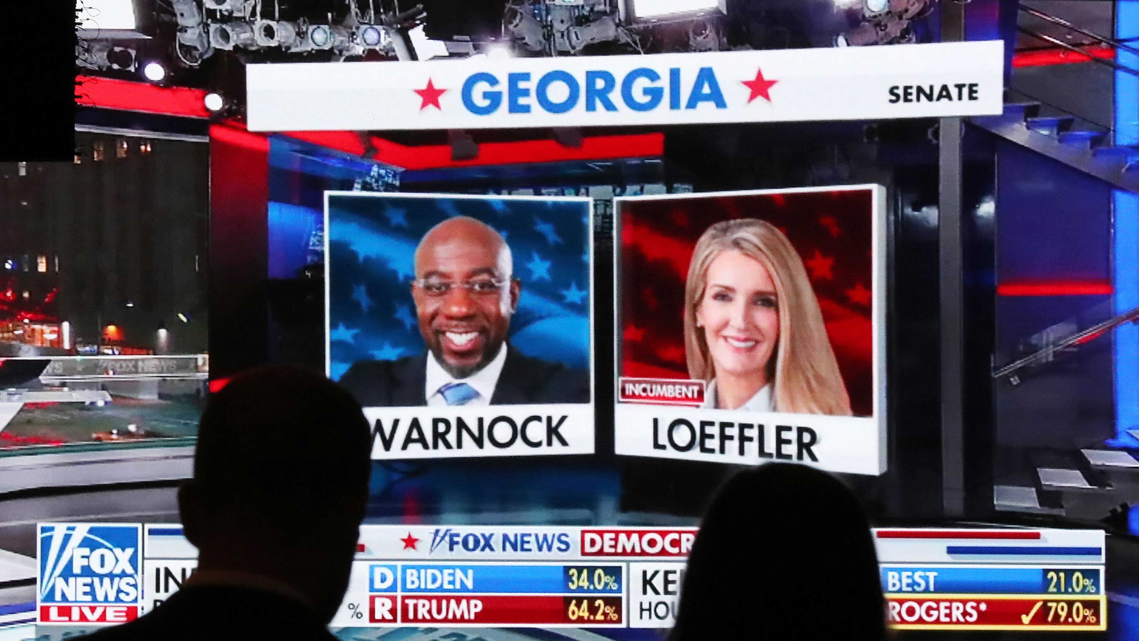 Republican supporters watch returns for Democratic U.S. Senate candidate Raphael Warnock and Republican incumbent Kelly Loeffler come in at the Georgia Republican Party Election Night Celebration Party at the Intercontinental Buckhead Atlanta hotel on Tuesday, Nov. 3, 2020, in Atlanta. (Curtis Compton/Atlanta Journal-Constitution/TNS)