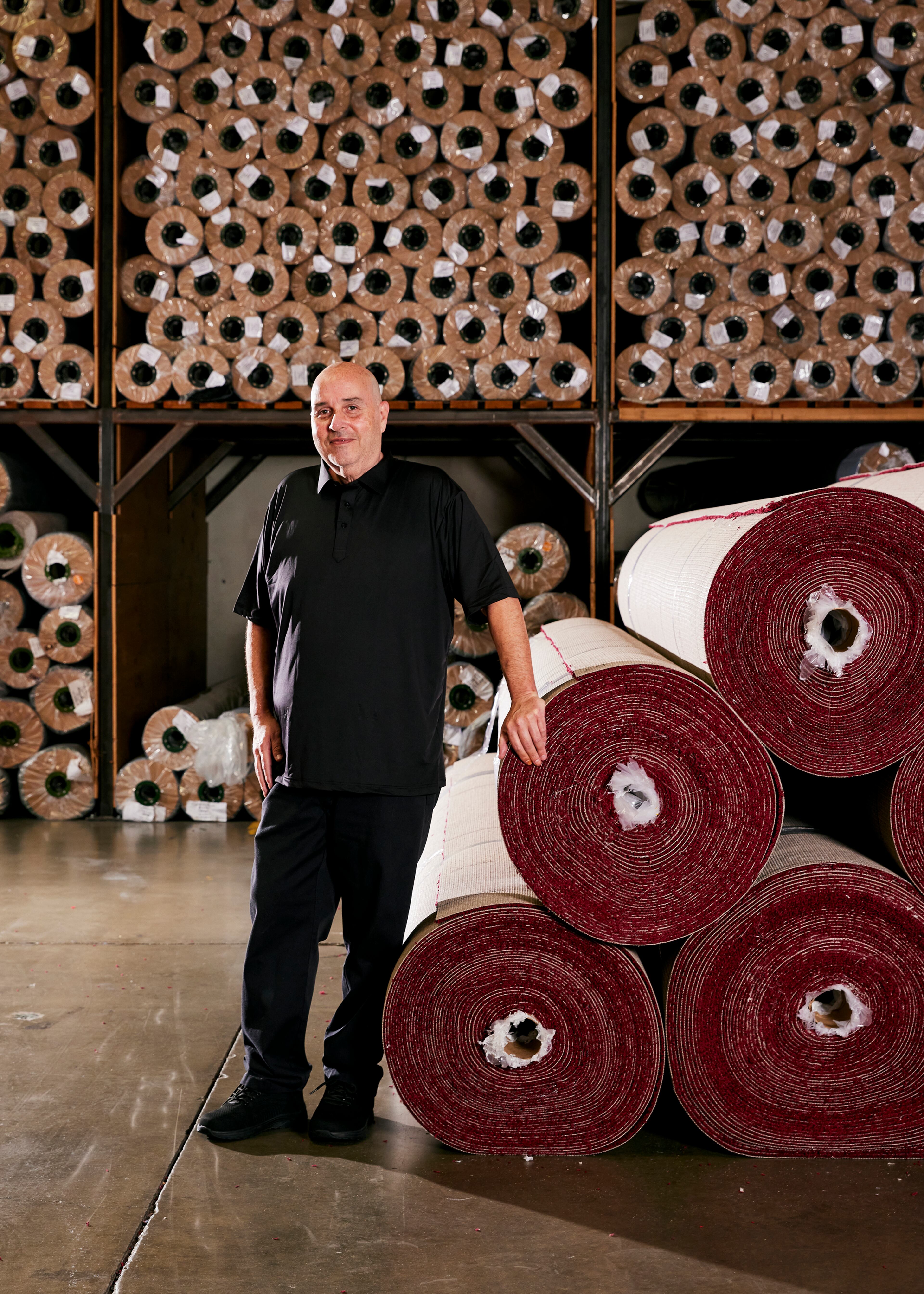 Steve Olive, the co-founder of Event Carpet Pros, with rolls of red carpet his company installed at the Dolby Theater for the Oscars in Los Angeles, on Feb. 21, 2025. Olive, who has worked in the event carpet business for more than three decades, is the man the Academy trusts to get its iconic rug just right. (Jennelle Fong/The New York Times)