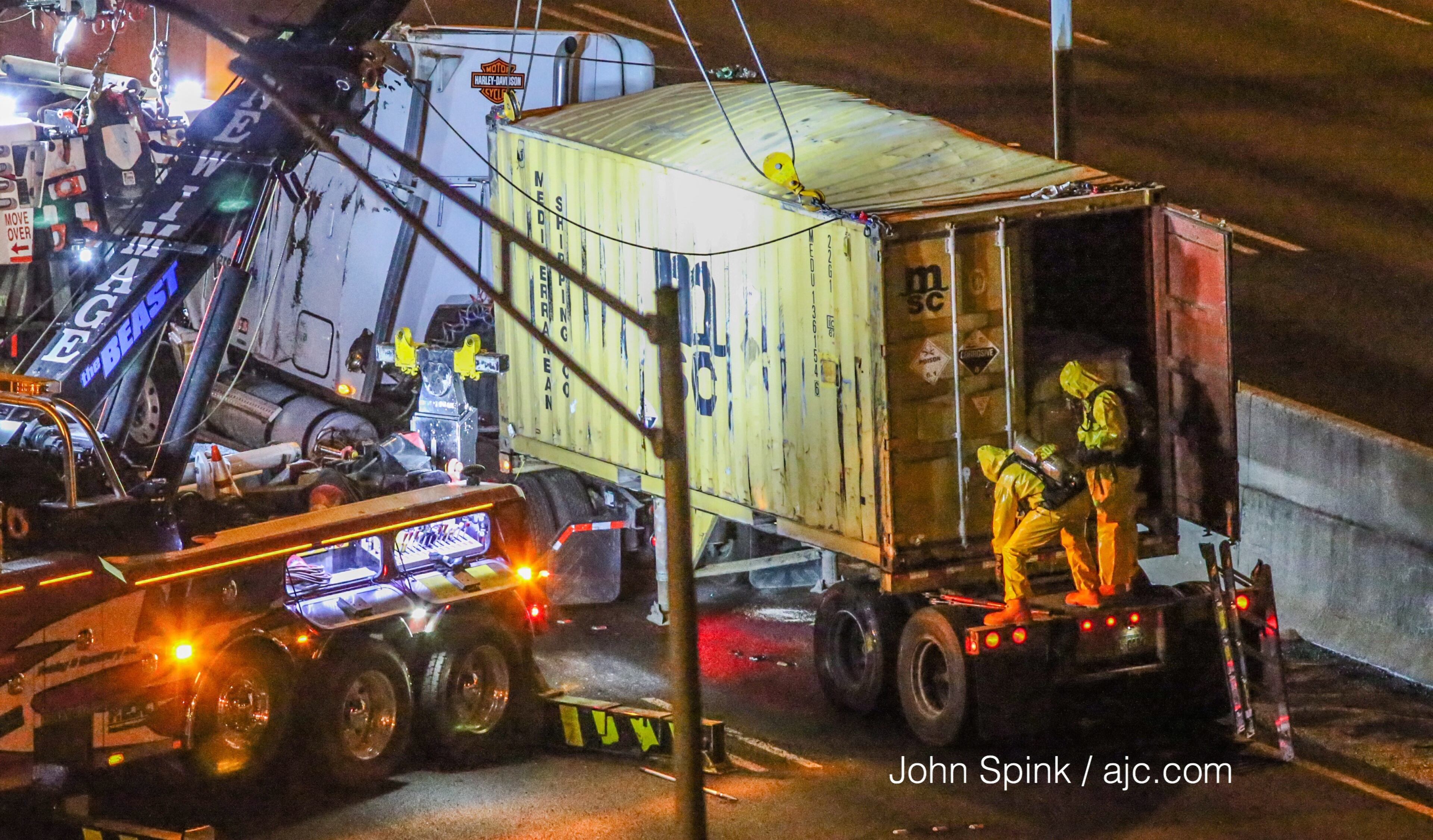 A tanker truck crash and chemical spill has the Downtown Connector closed in both directions at 10th Street. JOHN SPINK / JSPINK@AJC.COM
