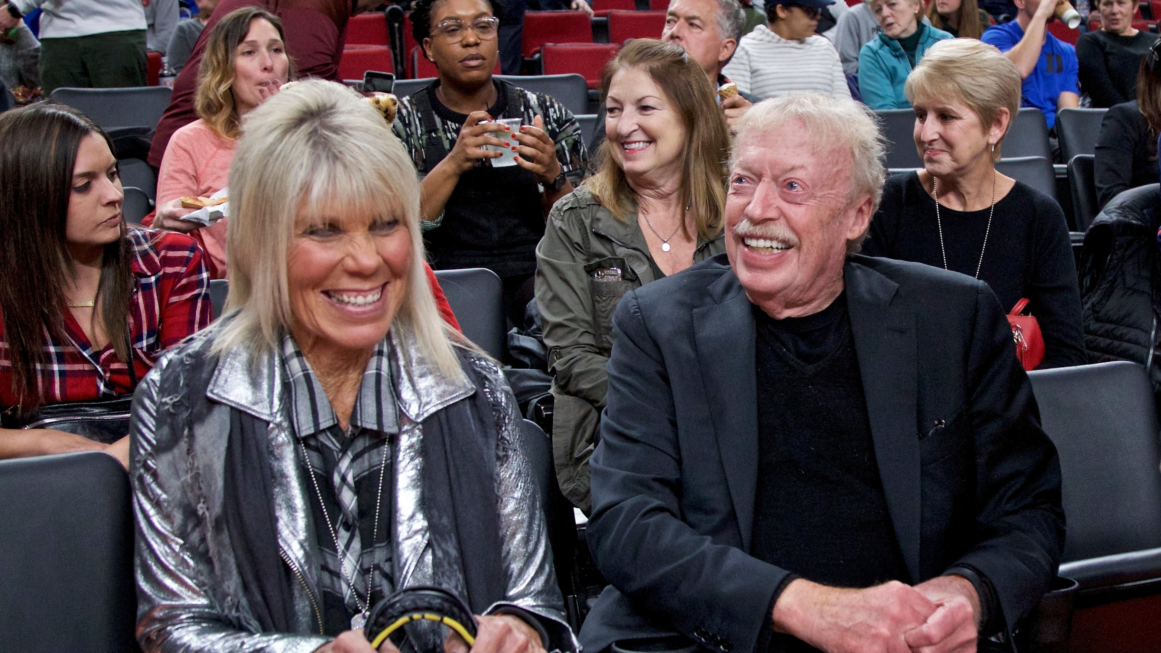 FILE - Phil Knight, right, and Penny Knight, watch the first half of an NCAA college basketball game in the Phil Knight Invitational tournament in Portland, Ore., on Nov. 26, 2017. (AP Photo/Craig Mitchelldyer, File)