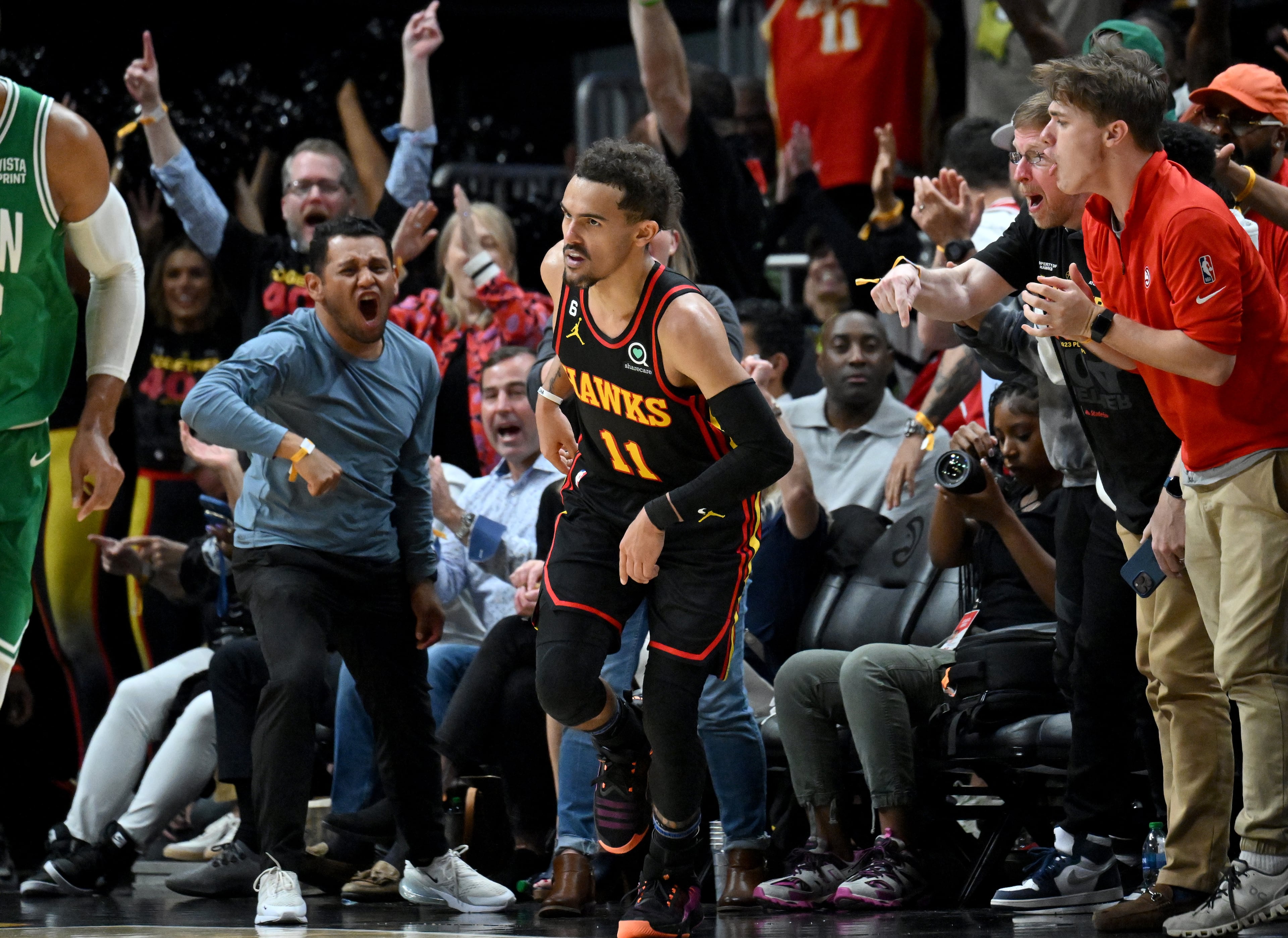 Atlanta Hawks’ guard Trae Young (11) celebrates after scoring during the second half in Game 3 of the first round of the Eastern Conference playoffs at State Farm Arena Friday. The Hawks won 130-122 over the Boston Celtics. (Hyosub Shin / Hyosub.Shin@ajc.com)