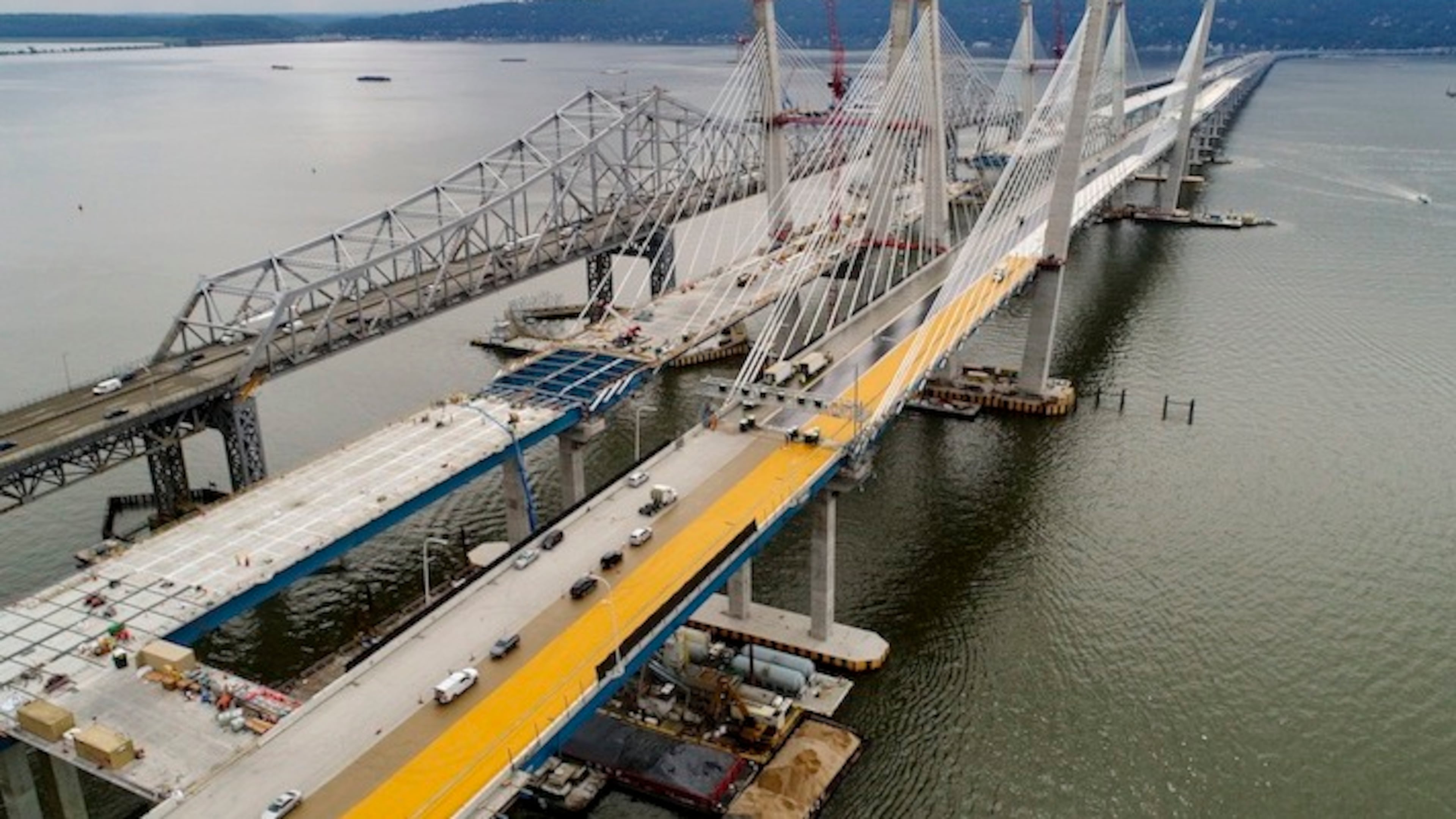 In this July 25, 2017 file photo, construction continues on the spans of the new Governor Mario M. Cuomo Bridge, right, as vehicles make their way on the the Tappan Zee Bridge over the Hudson River, near Tarrytown, N.Y. President Donald Trump's road to getting legislation through Congress this year to restore the nation's crumbling infrastructure appears increasingly precarious. (AP Photo/Julie Jacobson, File)