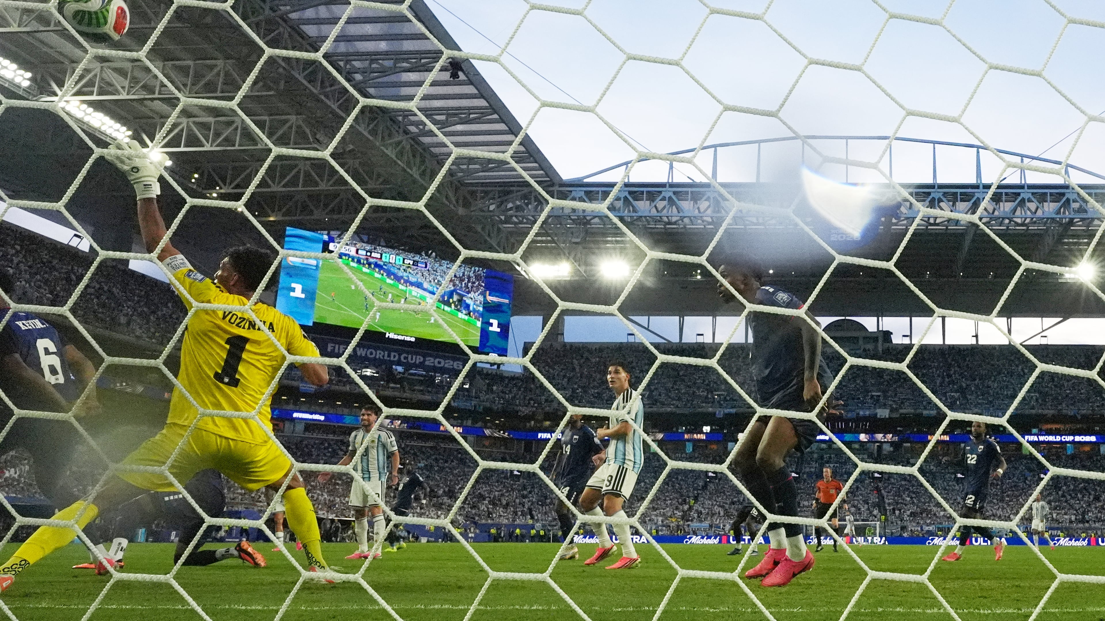 Cape Verde goalkeeper Vozinha (1) is scored on by Argentina's Lisandro Martinez during the World Cup round of 32 soccer match between Argentina and Cape Verde in Miami Gardens, Fla., Friday, July 3, 2026. (AP Photo/Lynne Sladky)