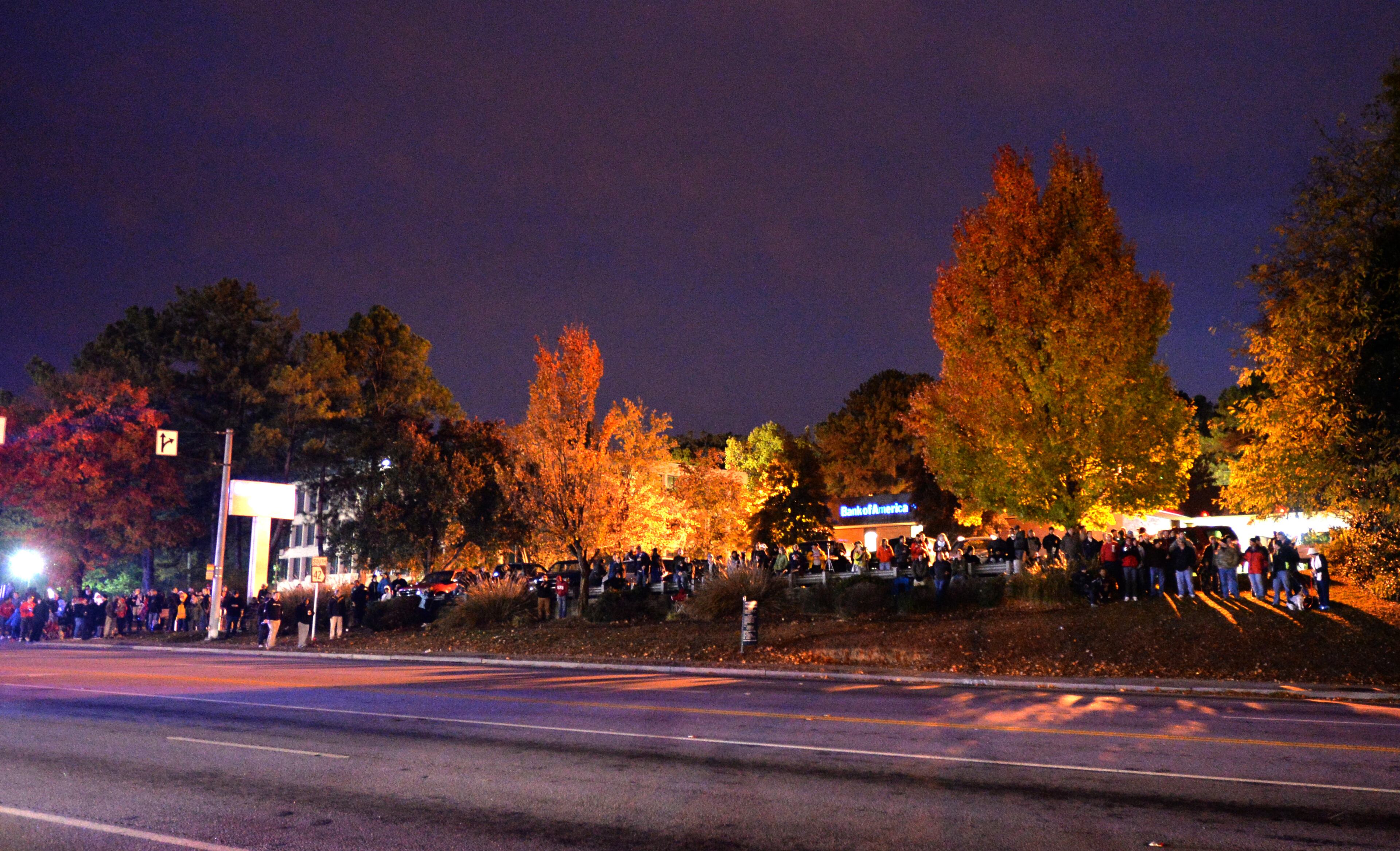 Hundreds of people gather to watch the 19-story former Executive Park Motor building being imploded at the corner of I-85 and North Druid Hills Road on Saturday morning, November 8, 2014.HYOSUB SHIN / HSHIN@AJC.COM