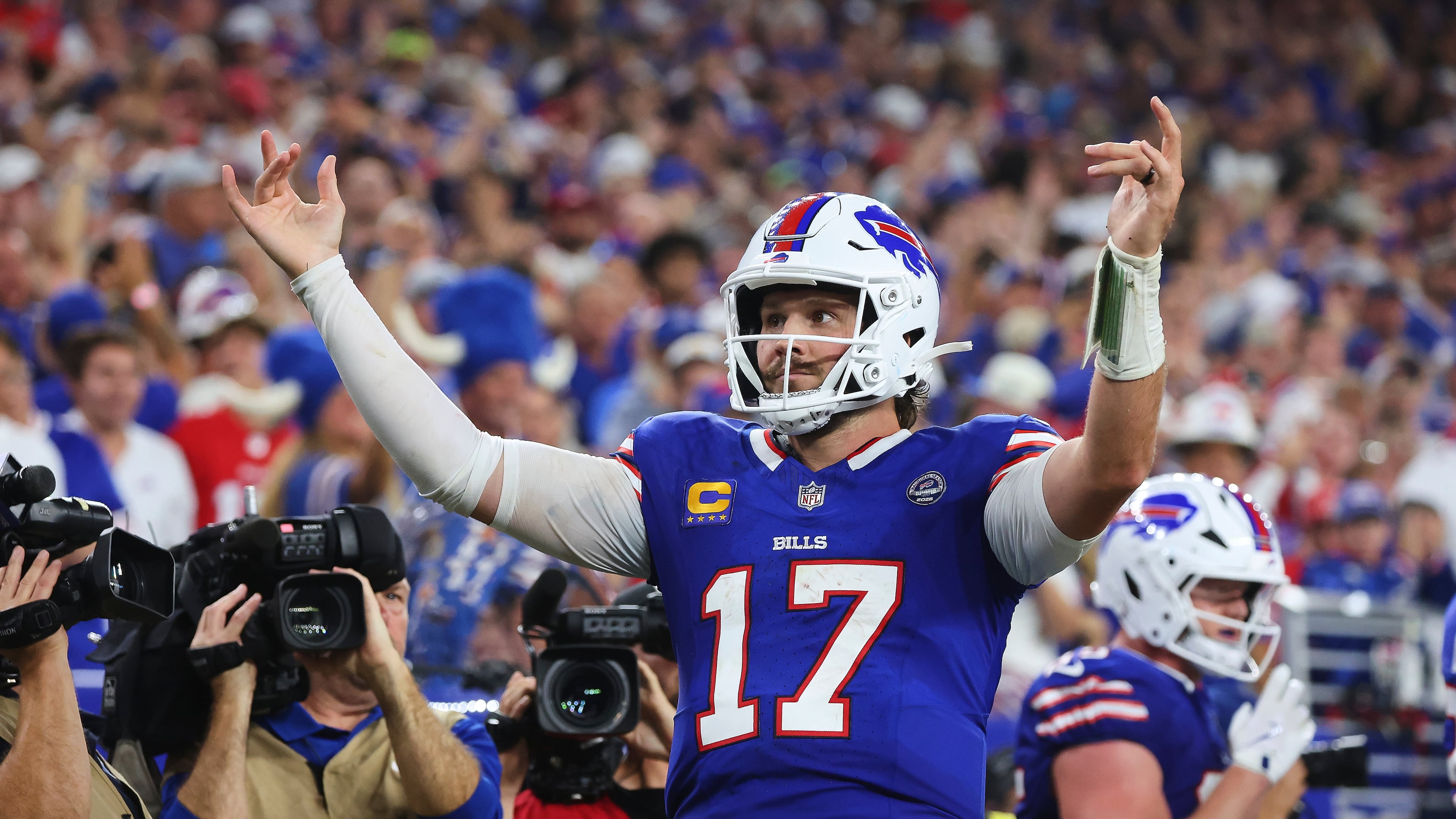 Buffalo Bills quarterback Josh Allen (17) celebrates his rushing touchdown against the Detroit Lions during the second half of an NFL football game in Orchard Park, N.Y., Thursday, Sept. 17, 2026. (AP Photo/Jeffrey T. Barnes )