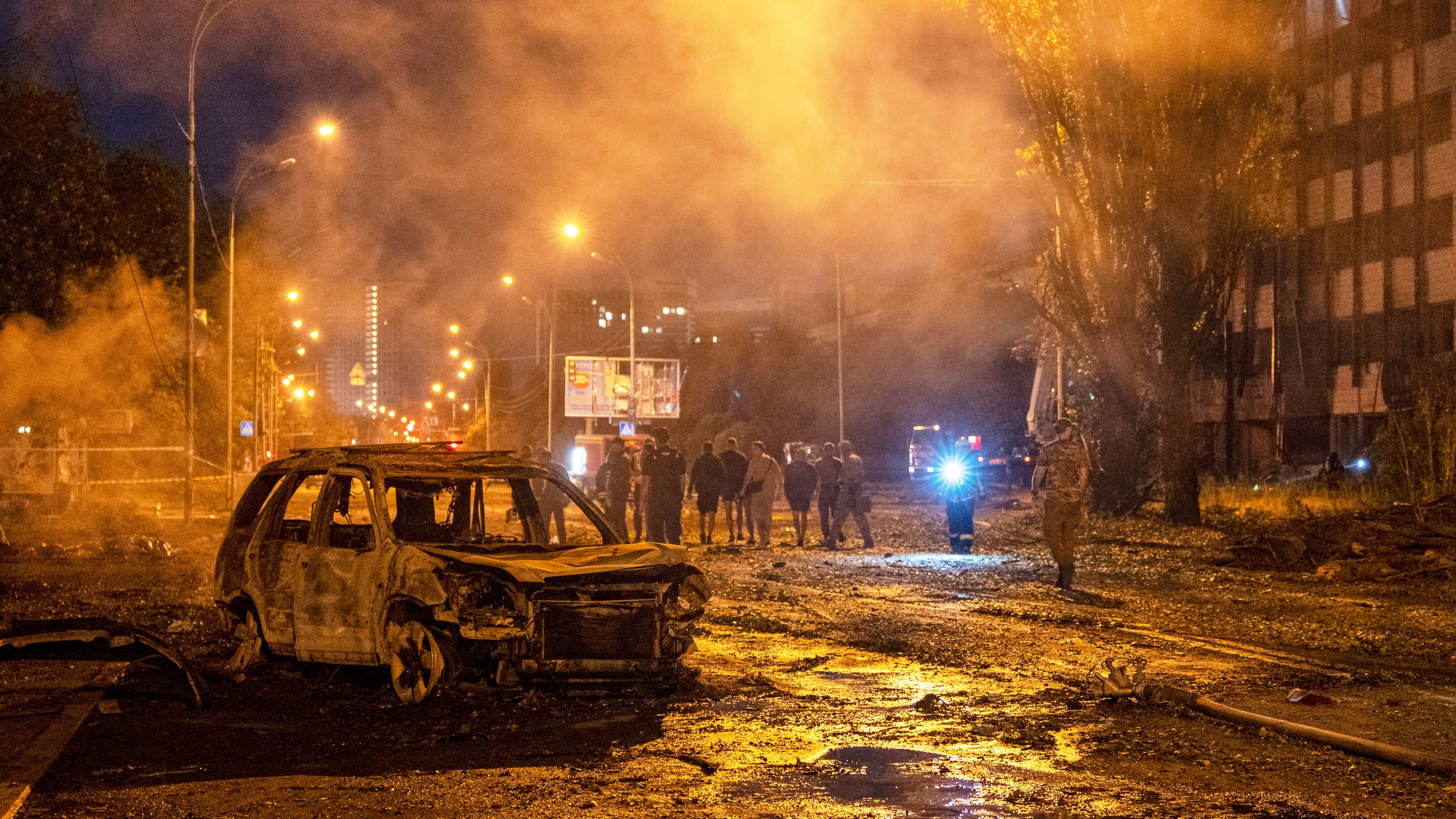 A burned car is seen after a Russian missile attack in Kyiv, Ukraine, Saturday, Aug. 1, 2026. (AP Photo/Dan Bashakov)