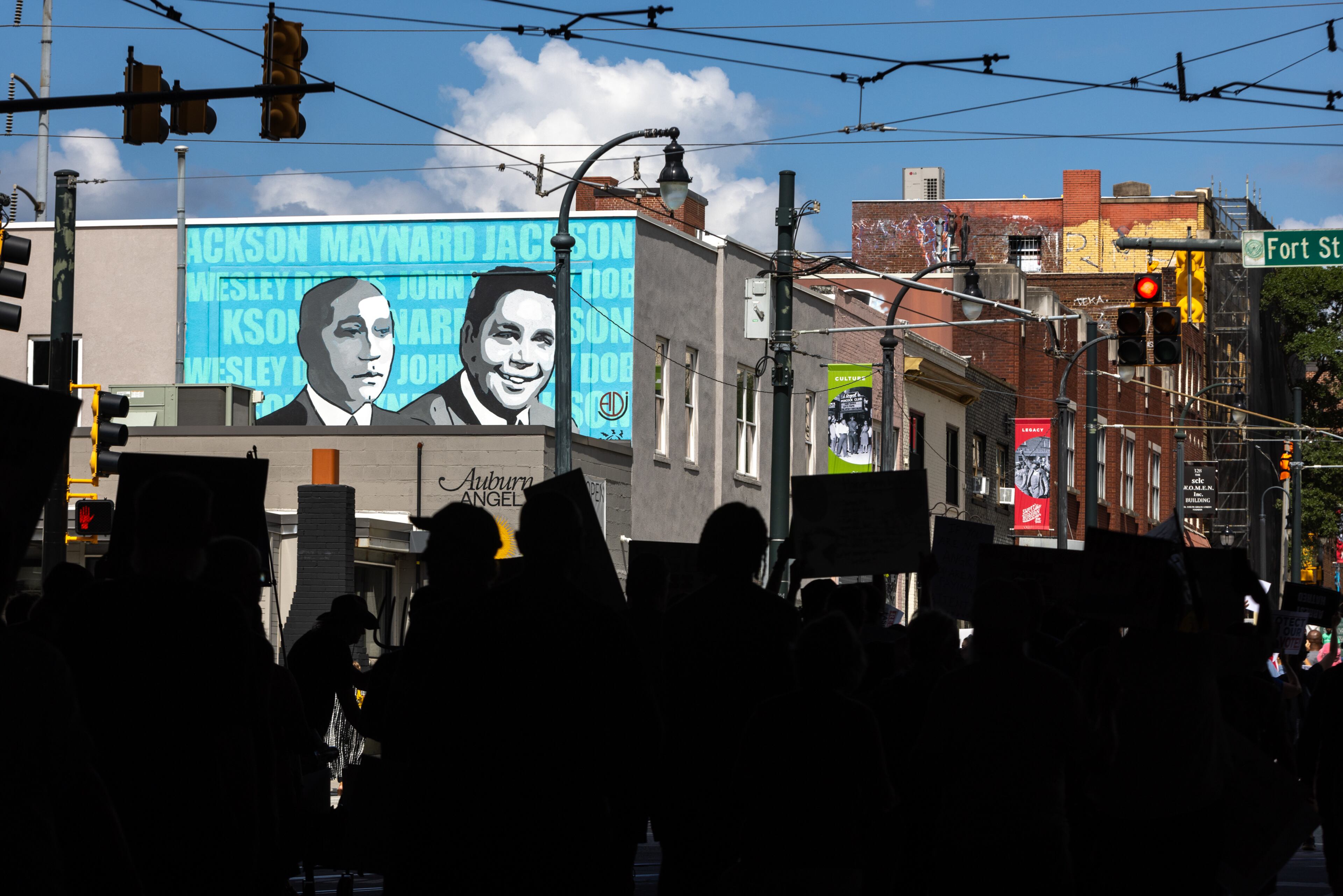 Protestors march toward Ebenezer Baptist Church during a “Good Trouble” protest in Atlanta on Thursday, July 17, 2025, part of a national effort to express frustration with the Trump administration. (Arvin Temkar/AJC)