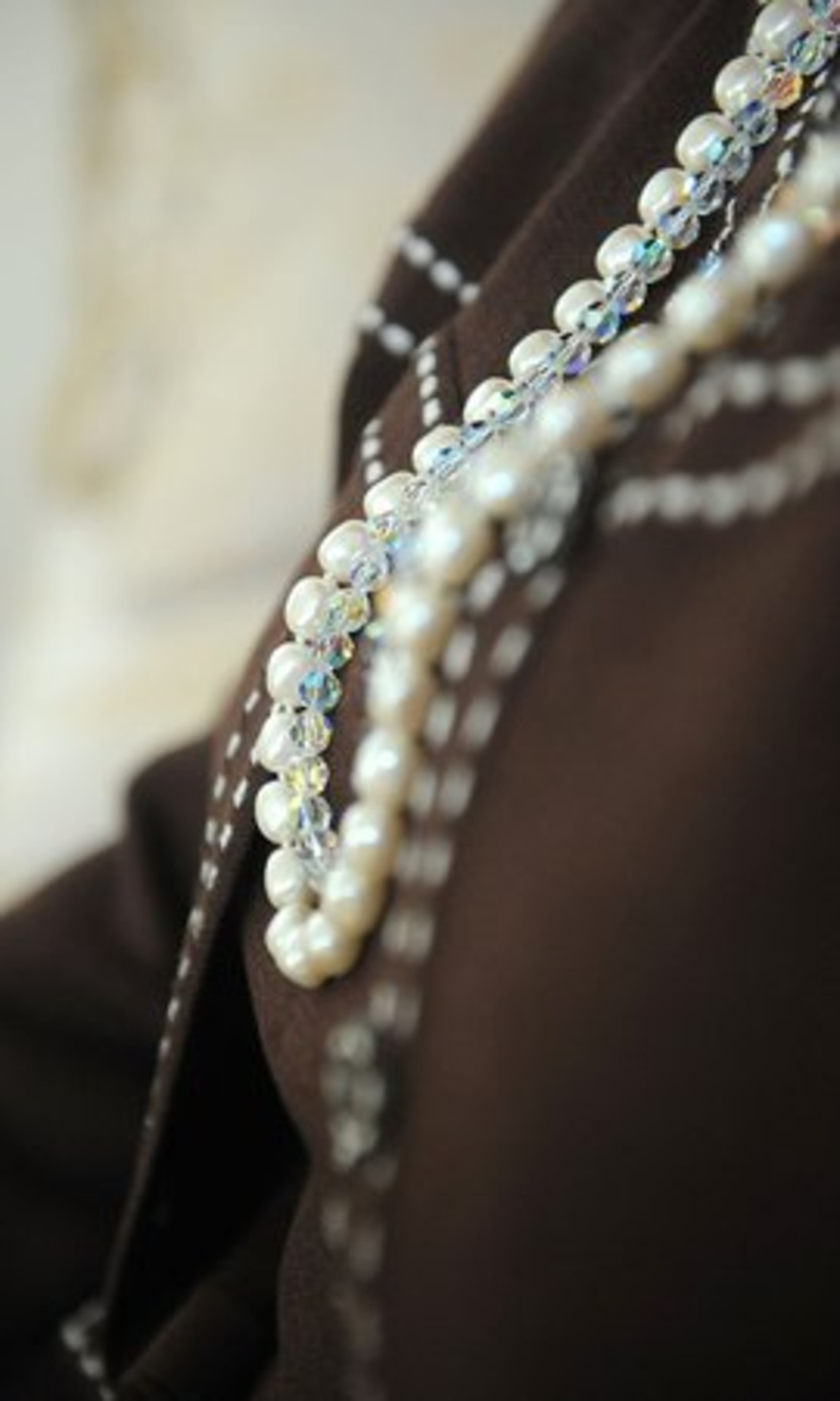 FAVORITE LABEL: St. John, of course. Here, Wilson sports a St. John Jacket and pearl necklace by Swarovski.