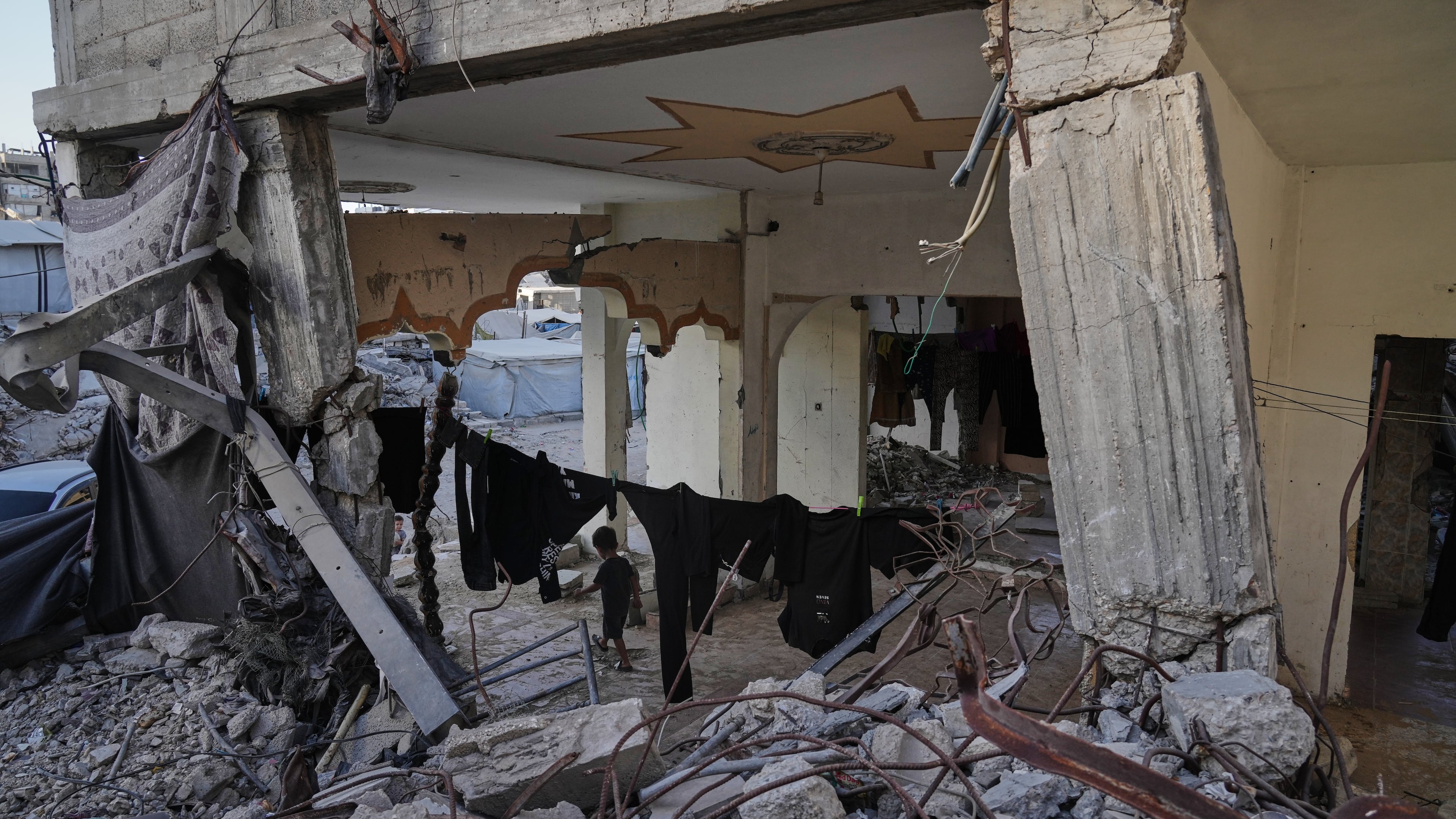 Displaced Palestinians shelter inside a building heavily damaged during the Israel-Hamas war in Gaza City, Thursday, Sept. 17, 2026. (AP Photo/Jehad Alshrafi)