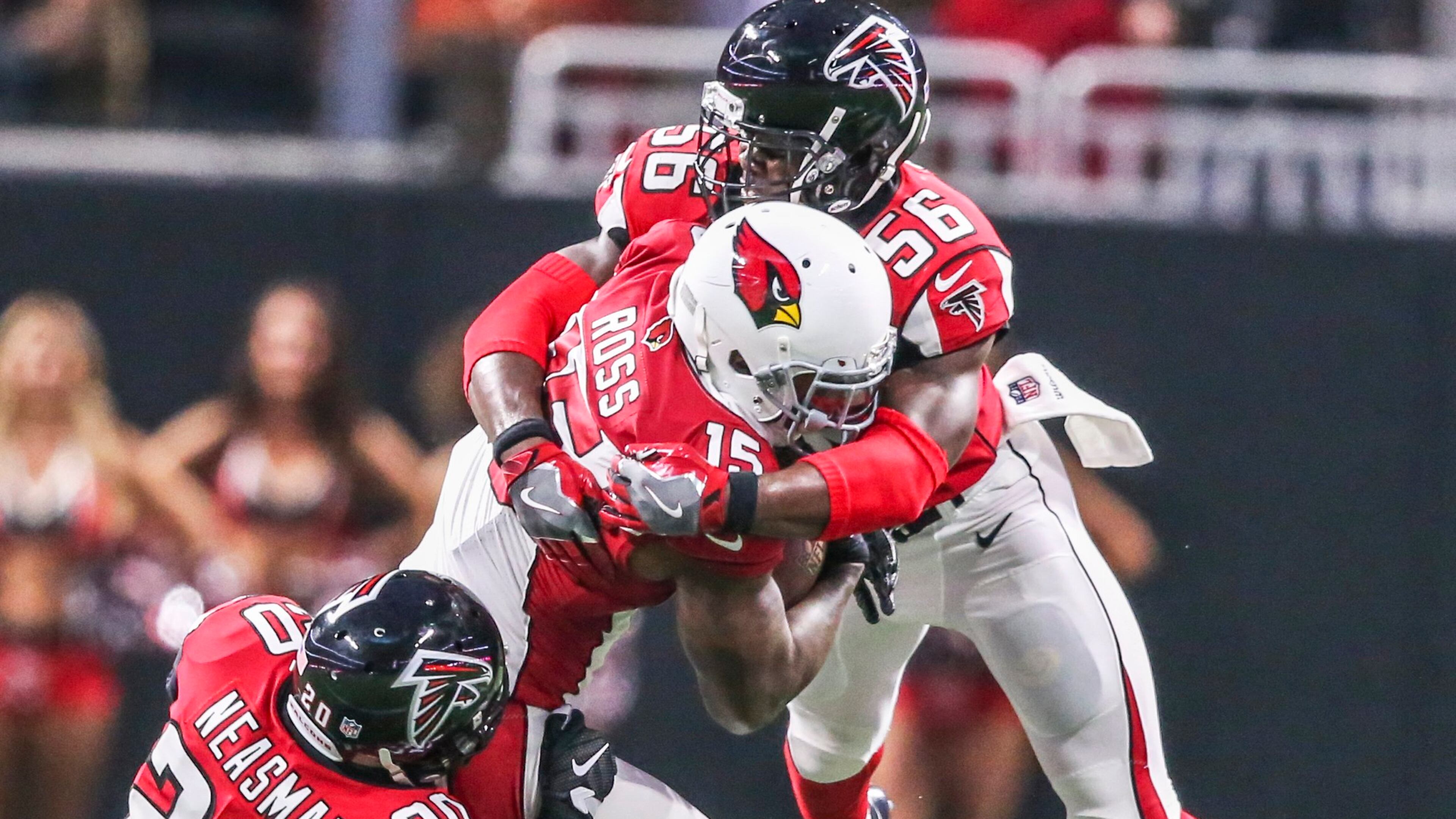 Atlanta Falcons defensive back Sharrod Neasman (20) (left) pulls down Arizona Cardinals wide receiver Jeremy Ross (15) (center) with Atlanta Falcons linebacker Jermaine Grace (56)(right) during 3rd quarter action on Saturday, Aug. 26, 2017 at the opening of the brand new Mercedes Benz Stadium and pre-season NFL game between the Atlanta Falcons and the Arizona Cardinals. JOHN SPINK/JSPINK@AJC.COM