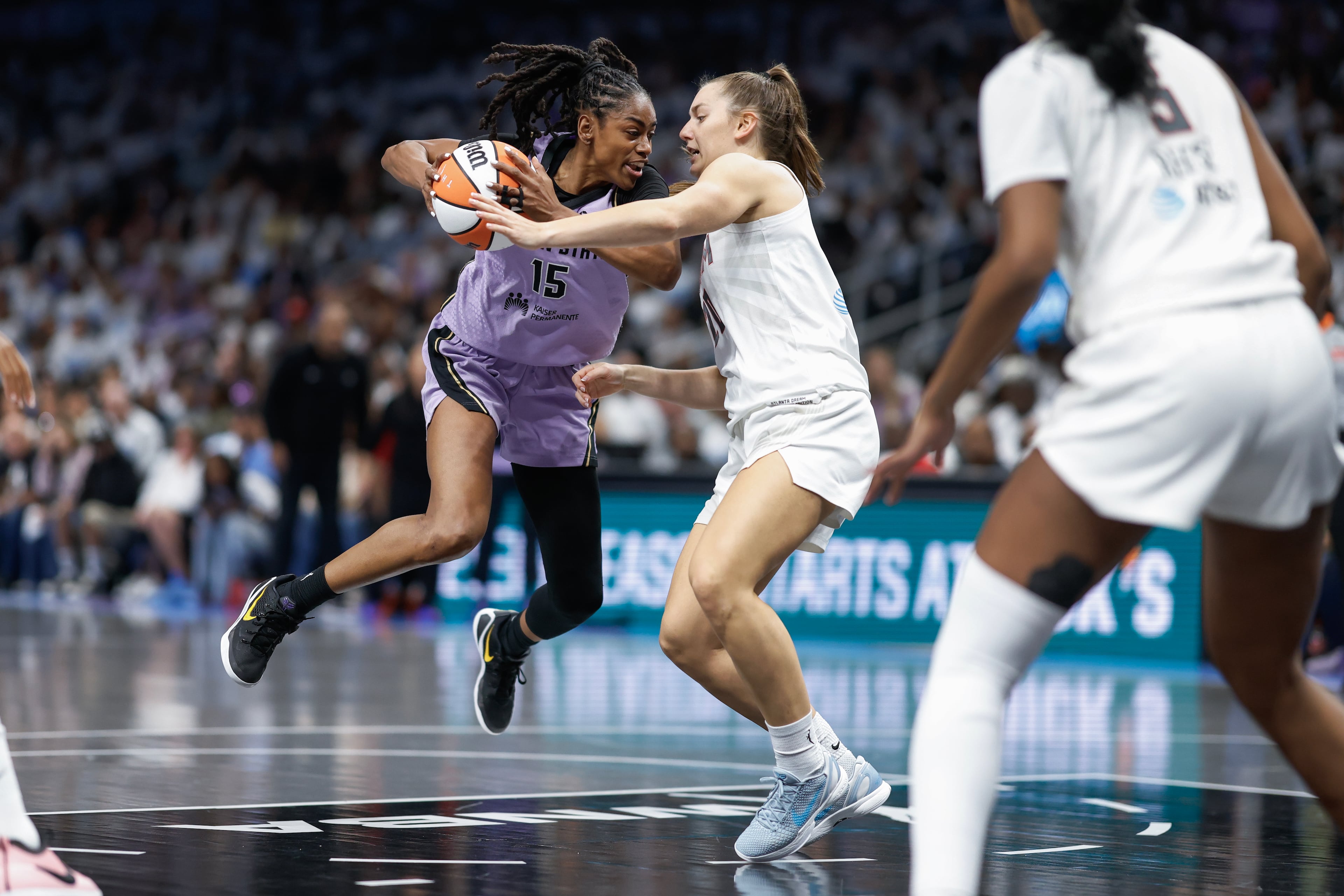 Golden State Valkyries guard Tiffany Hayes drives against Atlanta Dream guard Isobel Borlase during the first half of Game 4 of the WNBA Finals between the Atlanta Dream and the Golden State Valkyries, Saturday, Oct. 24, 2026, in Atlanta. (Erik S. Lesser for the AJC)