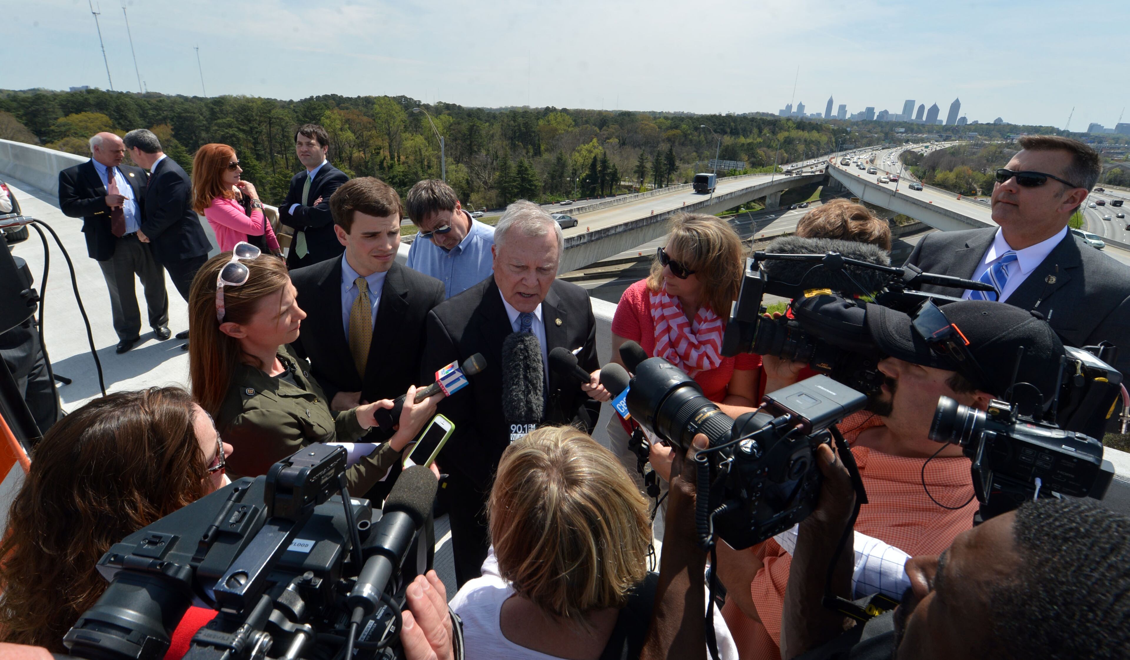 Governor Nathan Deal talks with the media following the program. Deal and other state and local leaders conducted a brief ribbon-cutting celebration of the opening of the new flyover ramps Wednesday, April 2, 2014. The ramps provide I-85 southbound traffic with direct access to GA 400 northbound and also give GA 400 southbound motorists a direct ramp to I-85 northbound.