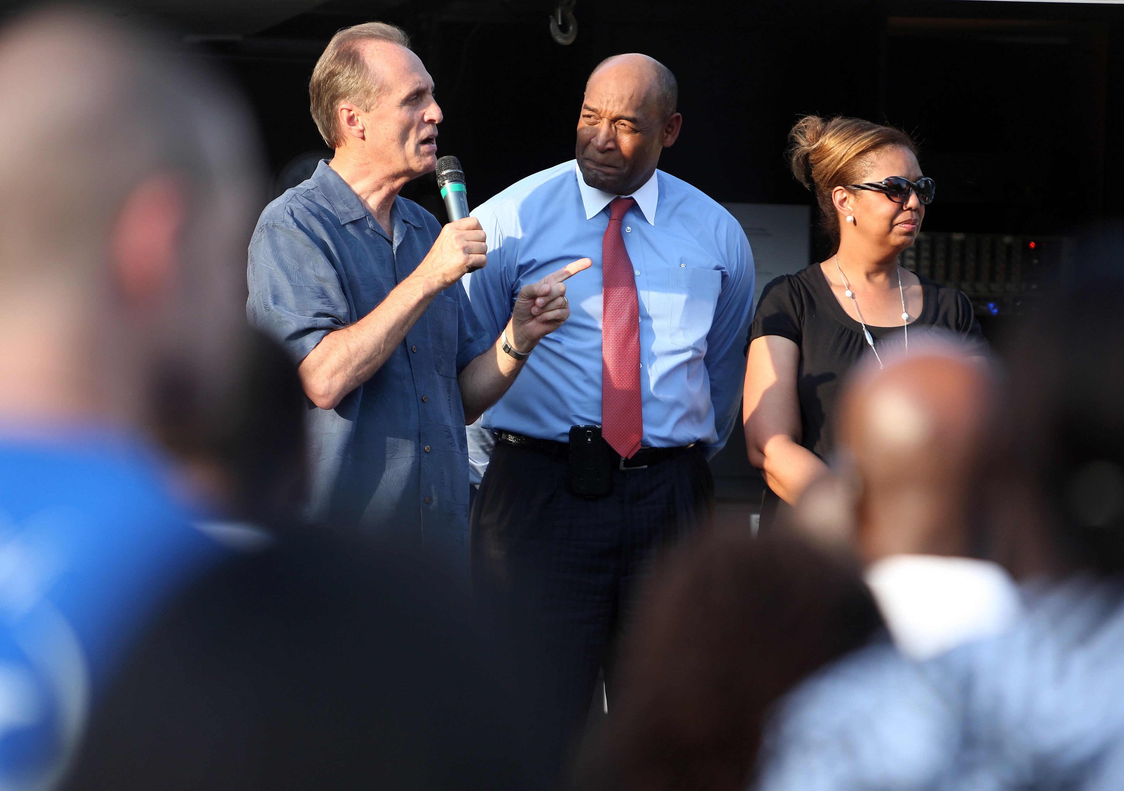 May 27, 2014 Roswell: World Harvest Church Pastor Mirek Hufton, left, speaks on stage with Richard and Millicent Jones during a prayer vigil for the Jones son Ben who went missing after saying he was headed to pick up graduation tickets at Morehouse College. About two hundred friends, neighbors and fellow church members showed up for the Tuesday evening May 27, 2014 prayer vigil. BEN GRAY / BGRAY@AJC.COM