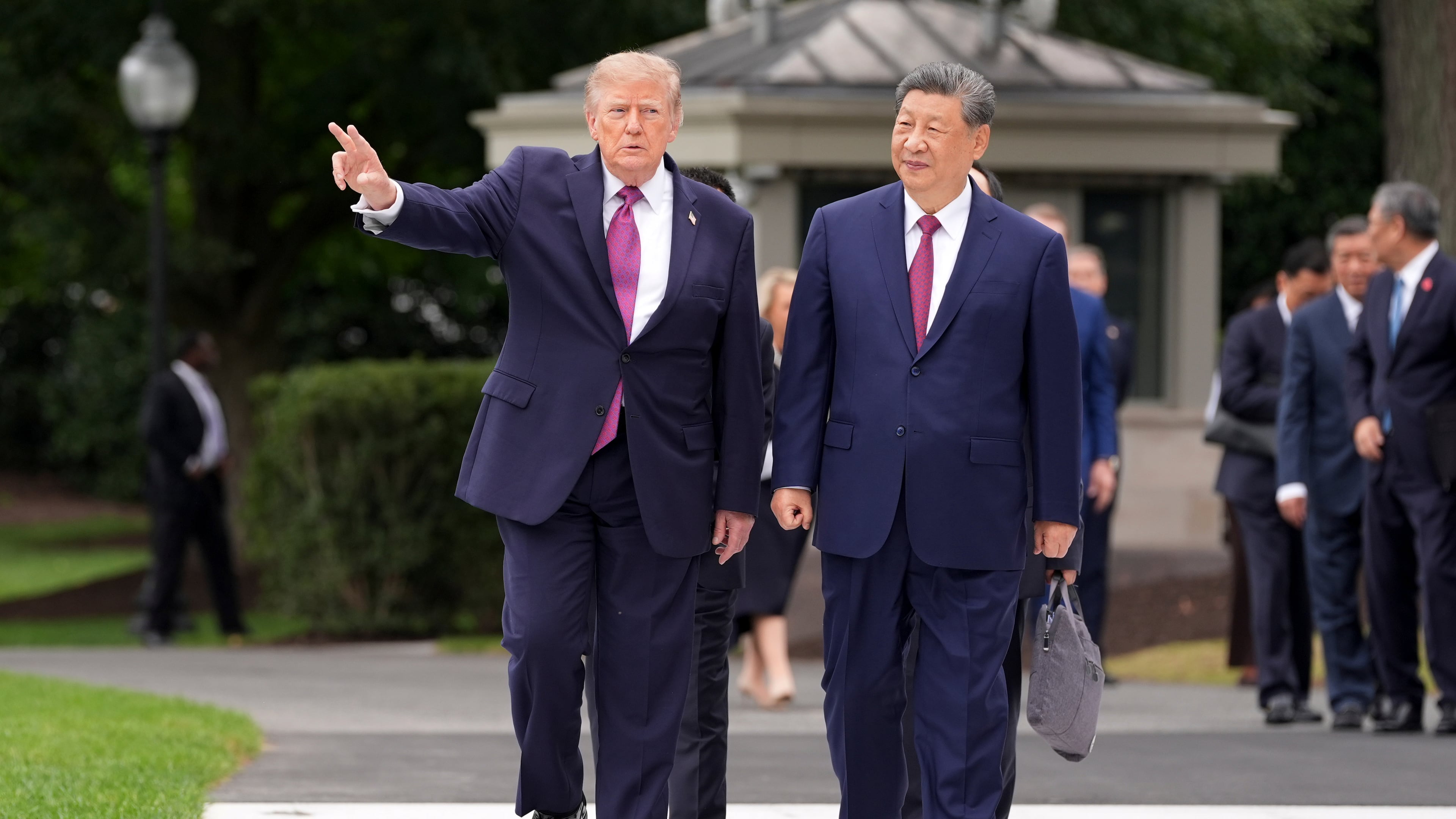 President Donald Trump, left, speaks with China's President Xi Jinping during a tour of the South Lawn of the White House, Thursday, Sept. 24, 2026, in Washington. (AP Photo/Alex Brandon)