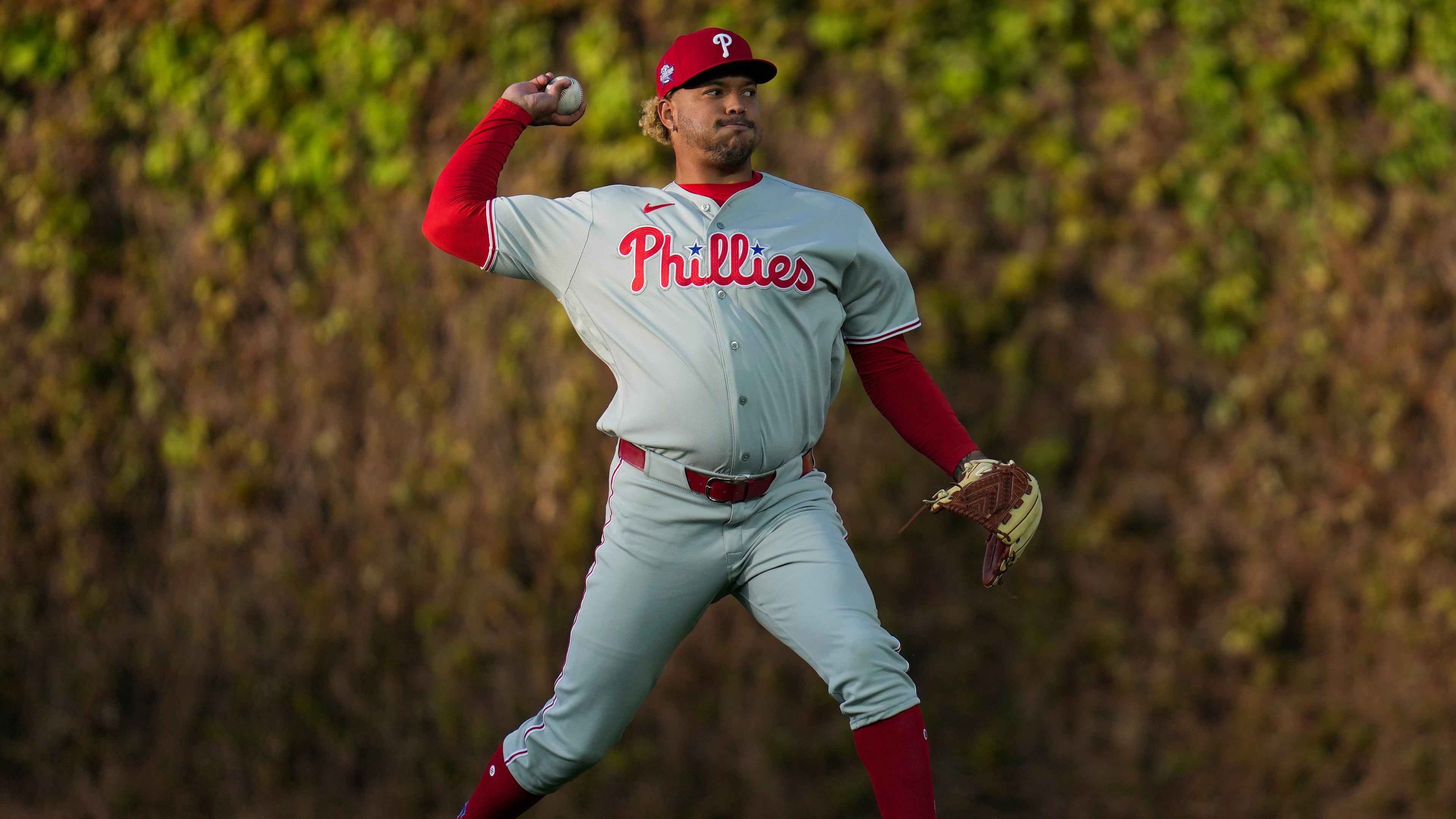 Philadelphia Phillies pitcher Taijuan Walker (99) warms up before a baseball game against the Chicago Cubs, Wednesday, April 22, 2026, in Chicago. (AP Photo/Erin Hooley)