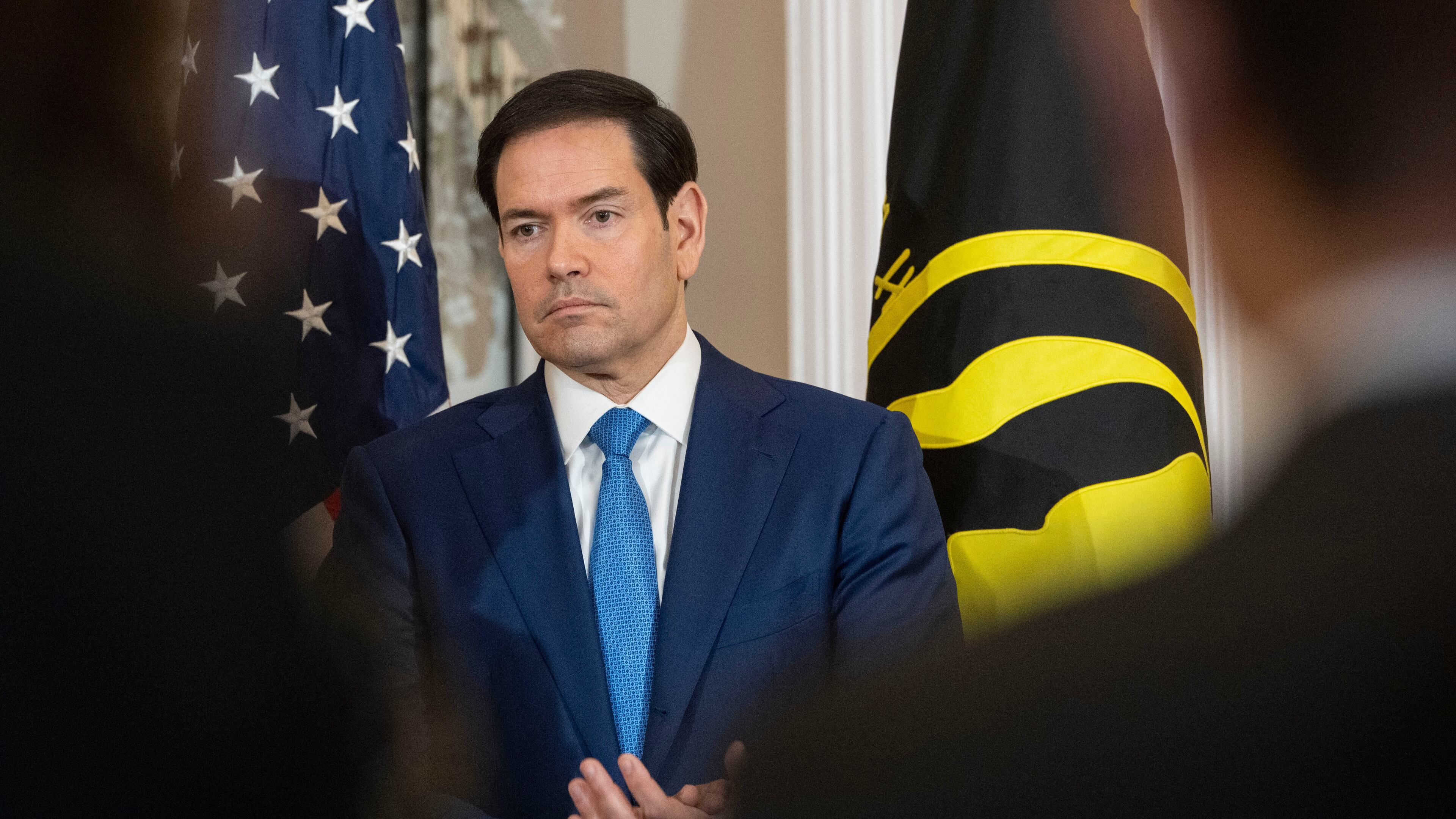 Secretary of State Marco Rubio takes part in a U.S. Hostage and Wrongful Detainee Flag Raising ceremony at the State Department, Monday, March 9, 2026 in Washington. (AP Photo/Kevin Wolf)