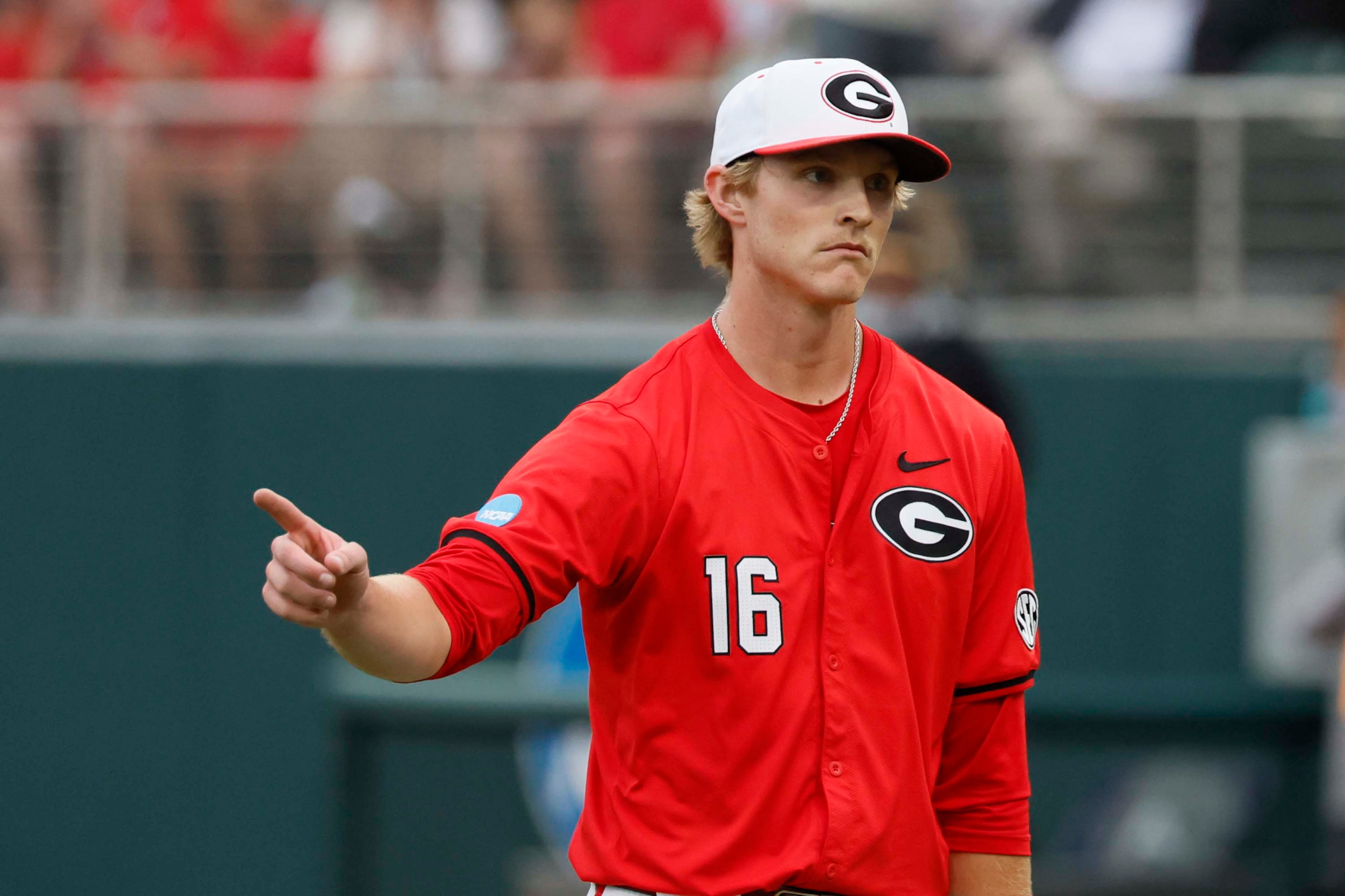 Georgia Bulldogs pitcher Zach Brown (16) reacts after striking out a Liberty batter during the seventh inning of their NCAA Regional final game at Foley Field on Sunday, May 31, 2026, in Athens. (Miguel Martinez/AJC)