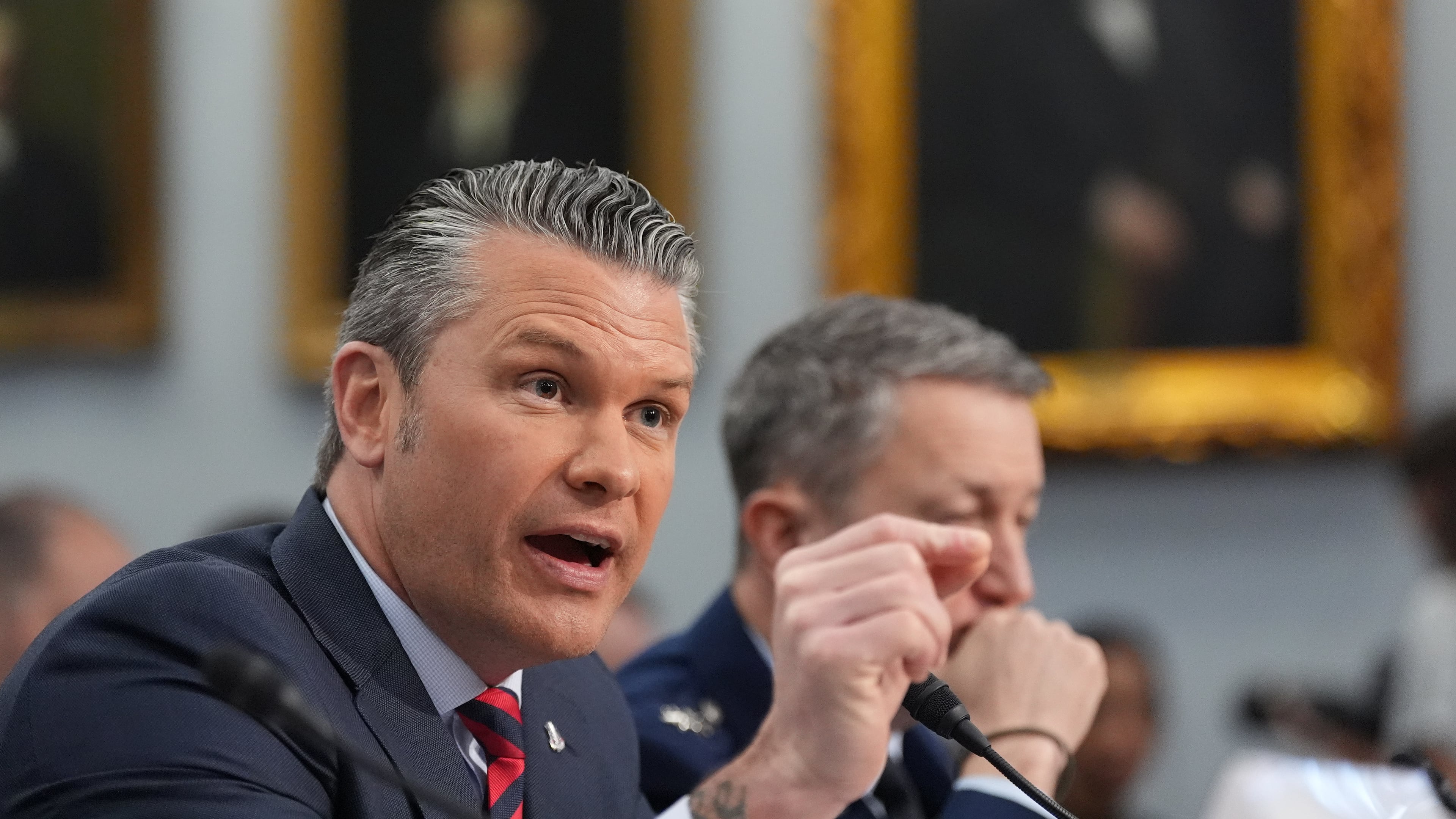 Defense Secretary Pete Hegseth testifies at a House Appropriations subcommittee budget hearing for the Department of Defense, Tuesday, May 12, 2026, in Washington, as Chairman of the Joint Chiefs of Staff Gen. Dan Caine listens. (AP Photo/Alex Brandon)