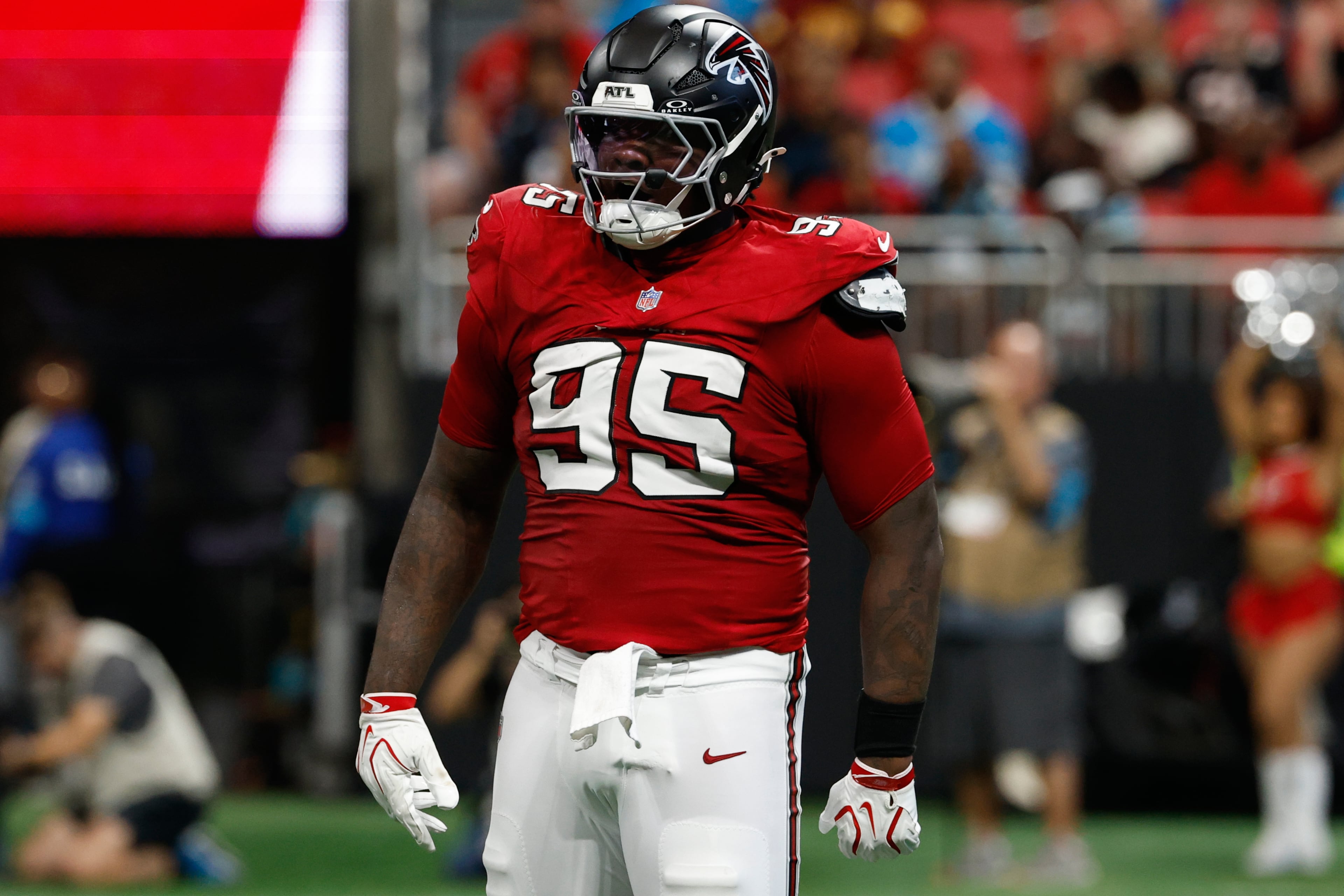 Defensive tackle Gervon Dexter Sr. celebrates after hitting Panthers quarterback Bryce Young in September. (Erik S. Lesser/AP)