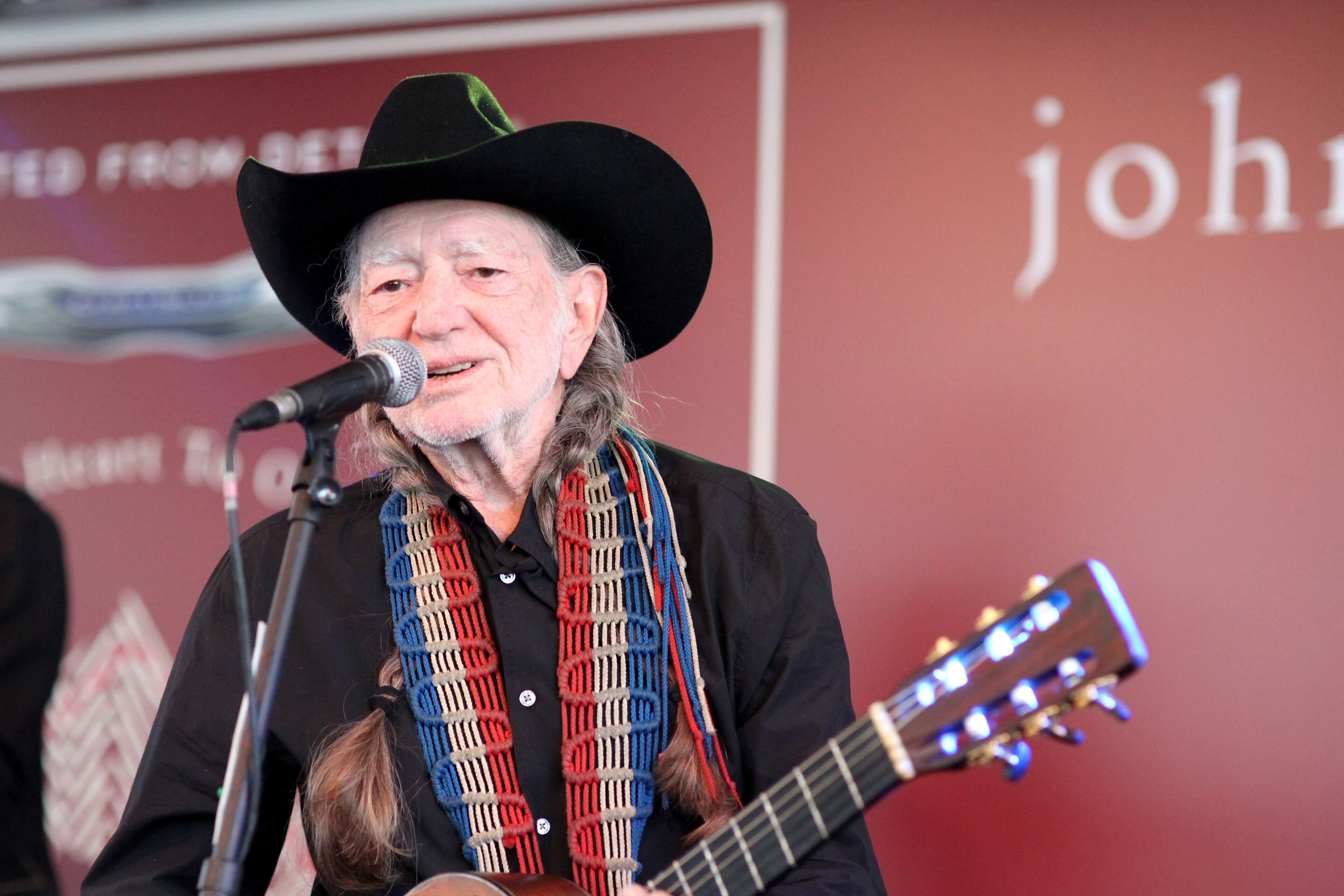 WEST HOLLYWOOD, CA - APRIL 13: Musician Willie Nelson performs onstage at the John Varvatos 11th Annual Stuart House Benefit presented by Chrysler, Kids Tent by by Hasbro at John Varvatos Boutique on April 13, 2014 in West Hollywood, California. (Photo by Gabriel Olsen/Getty Images for John Varvatos)