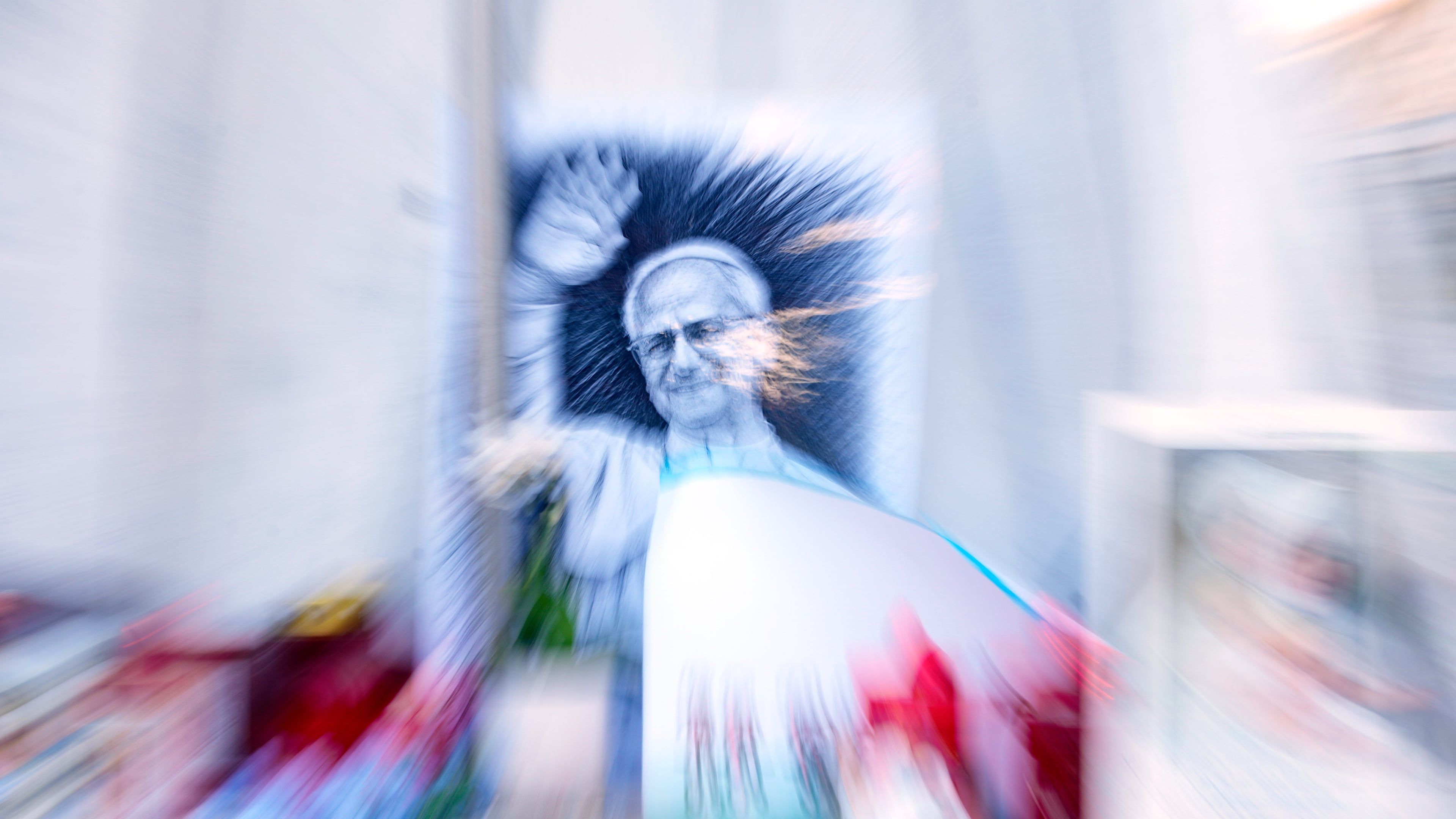 An image of Pope Leo XIV is seen under the statue of late Pope St. John Paul II at the Agostino Gemelli Polyclinic where the pontiff is hospitalised, in Rome, Friday, Oct. 16, 2026. (AP Photo/Gregorio Borgia)
