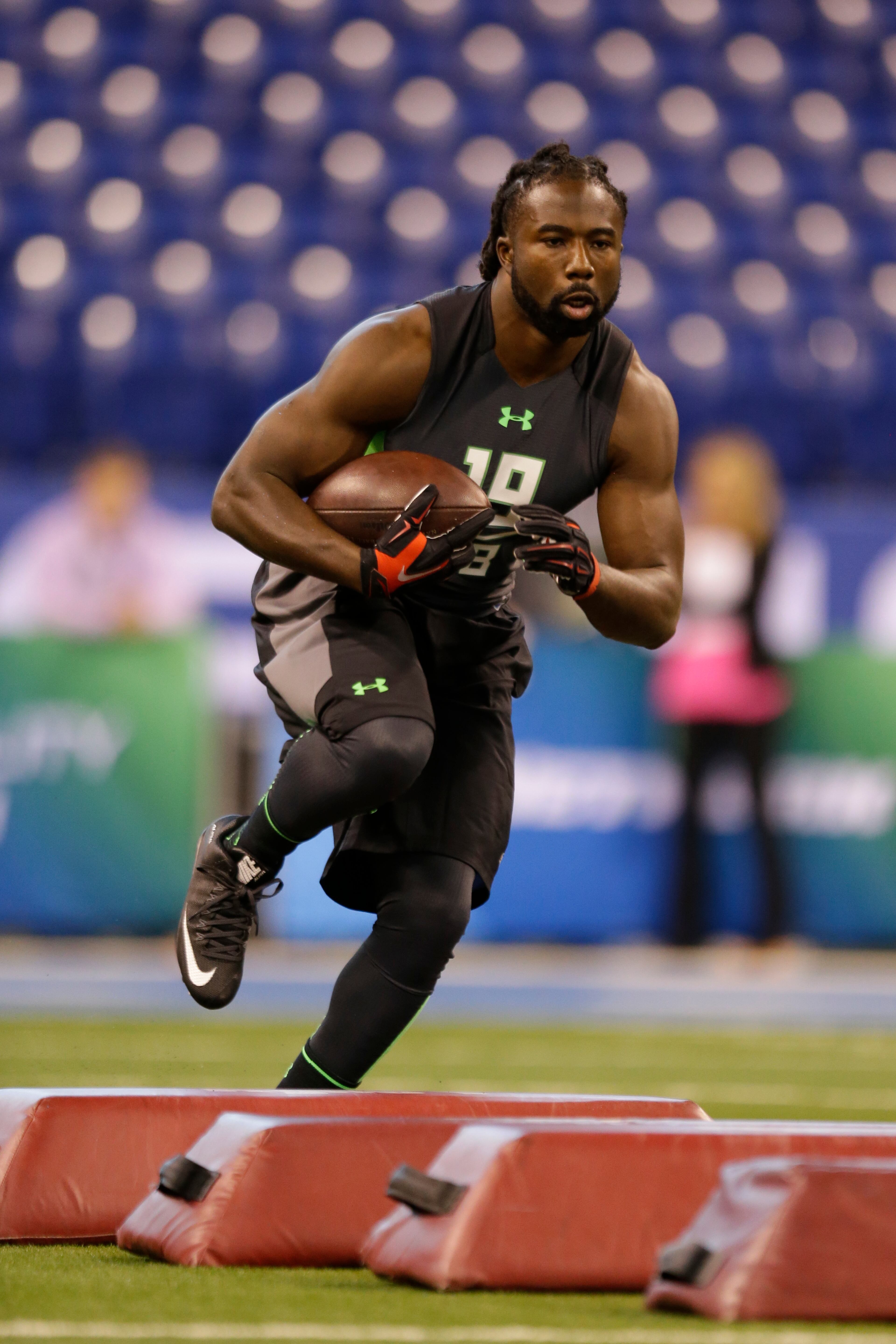 Georgia running back Keith Marshall runs a drill at the NFL football scouting combine in Indianapolis, Friday, Feb. 26, 2016. (AP Photo/Michael Conroy)