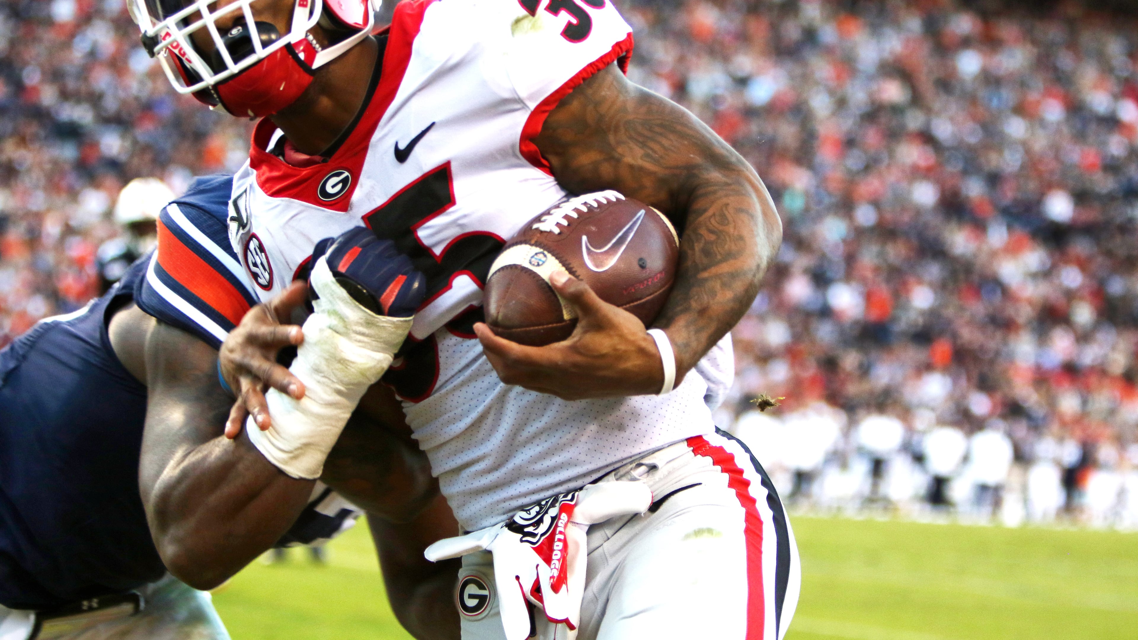 This is the last image UGA photographer Chamberlain Smith captured before she was run over and injured by Georgia running back Brian Herrien (35) in a sideline accident late in the second quarter Saturday, Nov. 16, 2019, at Jordan-Hare Stadium in Auburn.