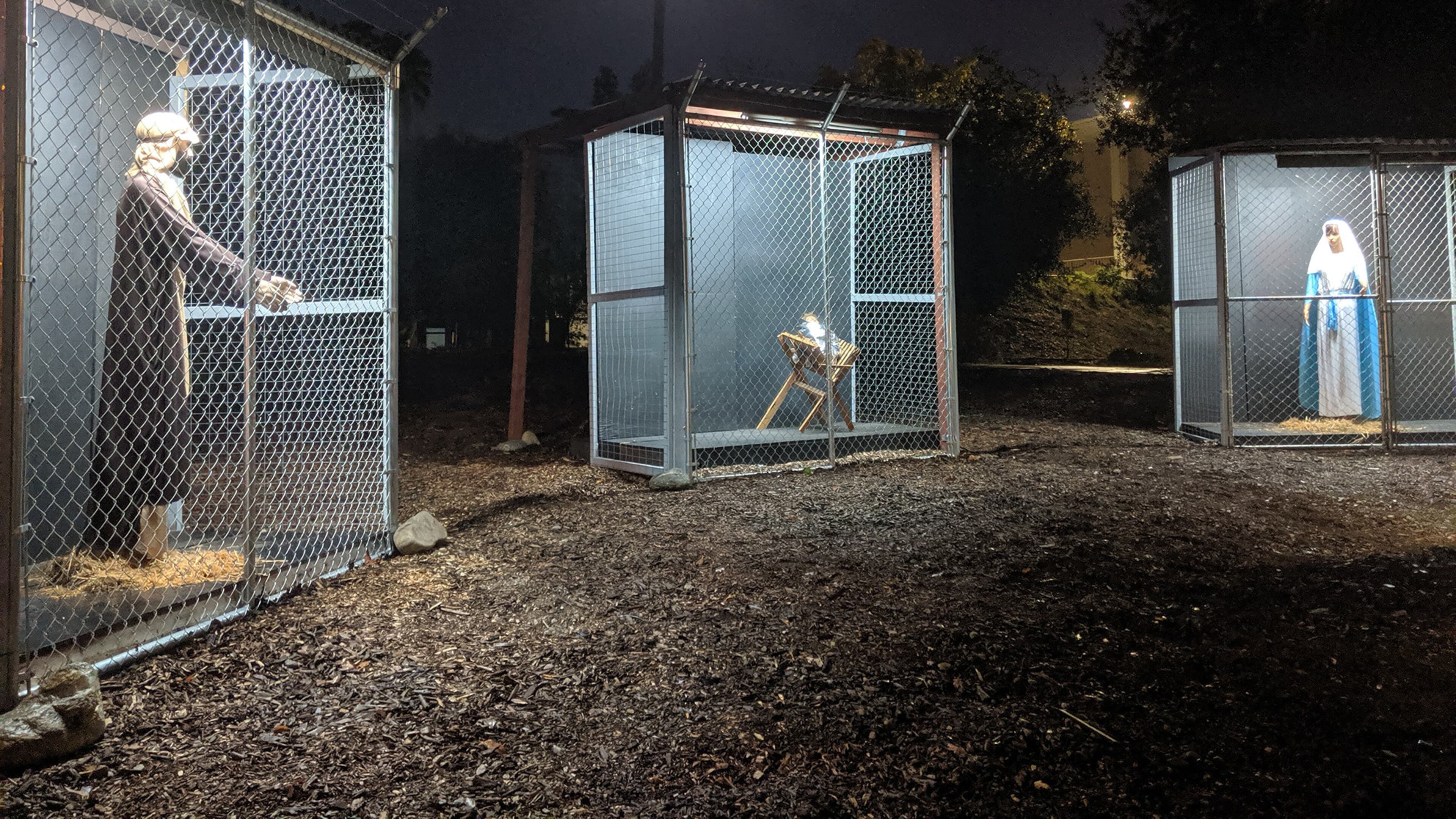 A Nativity scene at Claremont United Methodist Church depicts the Holy Family separated as refugees in cages
