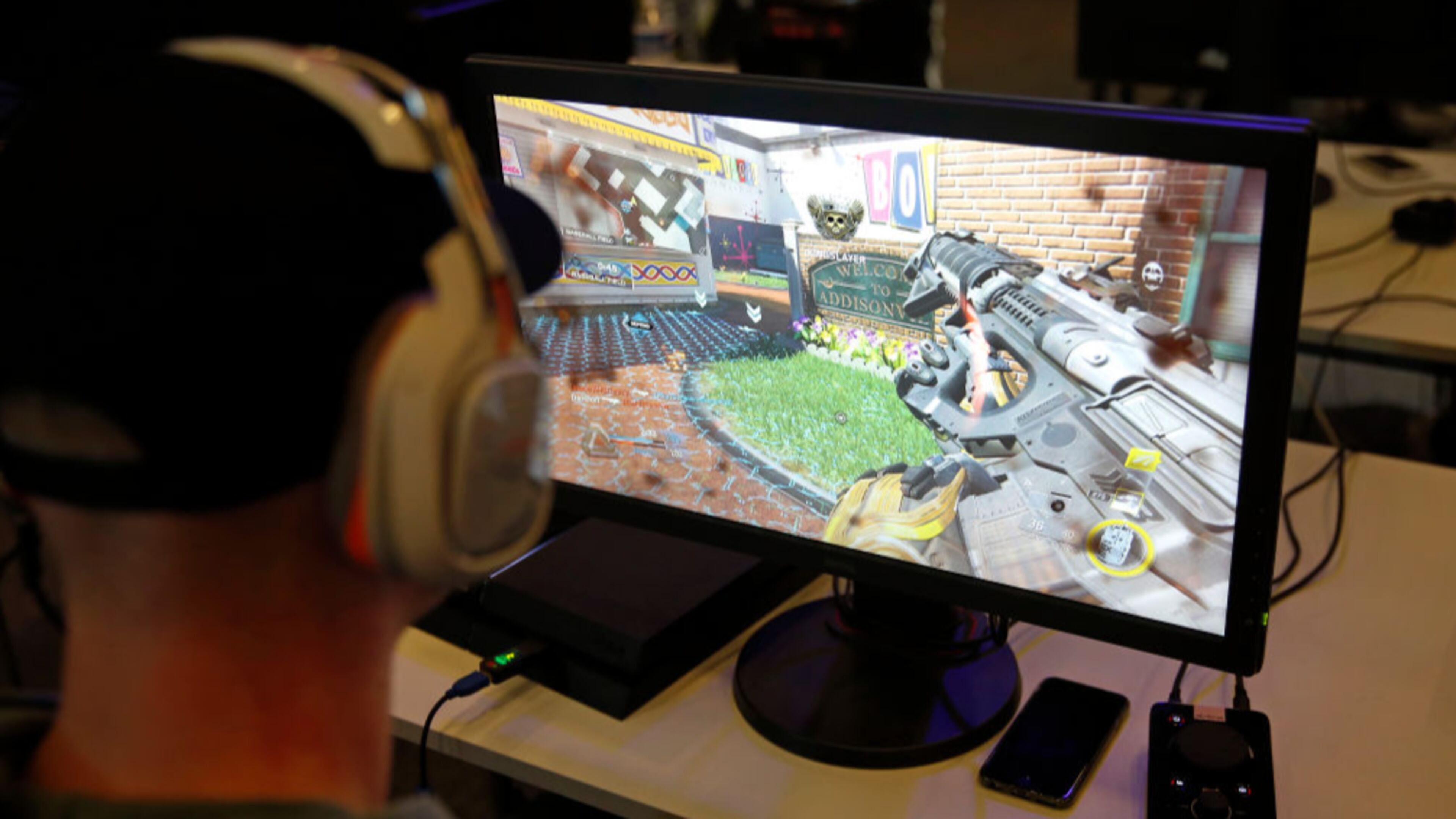 PARIS, FRANCE - FEBRUARY 18: A visitor plays a video game "Call of Duty" developed by Infinity Ward and published by Activision during an electronic video game tournament at the eSports World Convention (ESWC) on February 18, 2017 in Paris, France. The ESWC is the historic and emblematic event of electronic sports, bringing together every year since 2003 the best players in the world in video game tournaments designed as real live shows and broadcast live on the Internet or on television. 20 of the biggest American teams of Call of Duty will be present to compete in the tournament CWL Paris Open. Never had an event organized in Europe so much engaged the American eSport community. (Photo by Chesnot/Getty Images)