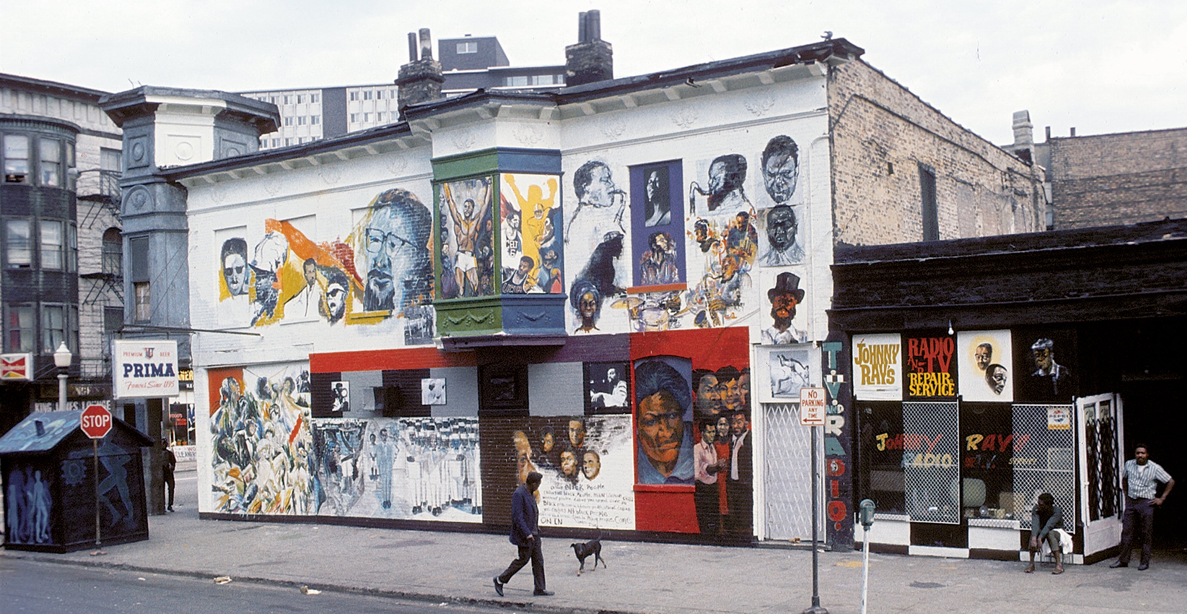 A man walks by 'The Wall of Respect', a public art project conceived by The Organization of Black American Culture, Chicago in 1967. Painted by a group of African American artists, the mural was on 43rd and Langley in Chicago's South Side. It depicts images of "Black Heroes" as positive role models for identity, community formation, and revolutionary action and was a spur to the public art movement. (Robert Abbott Sengstacke/Getty Images)