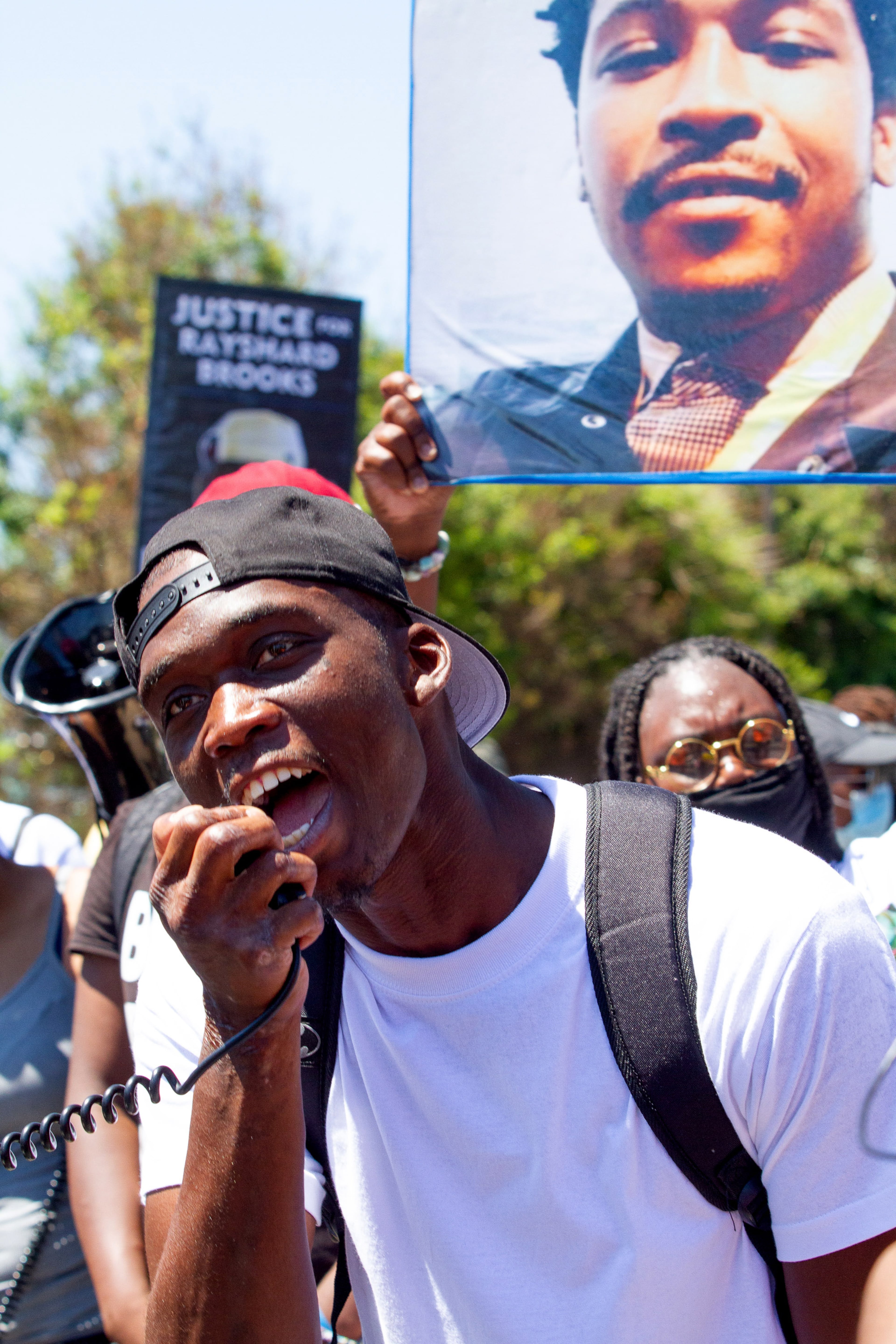 Nigel Cody speaks to the crowd during the 'Take Back the Wendy's' March & Rally on University Avenue in Atlanta on Saturday, July 11, 2020. STEVE SCHAEFER FOR THE ATLANTA JOURNAL-CONSTITUTION
