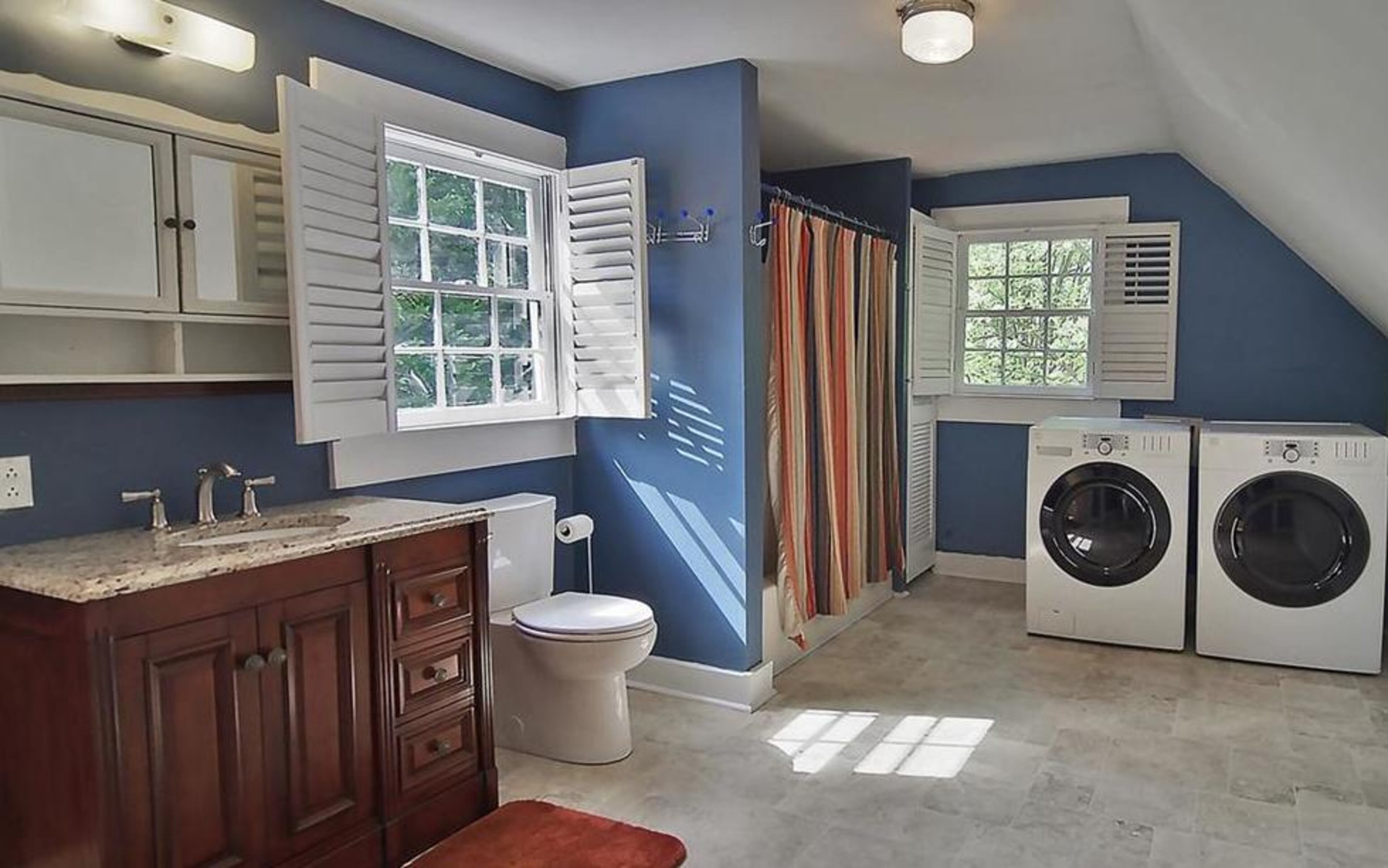 This room combined a bathroom and laundry space before the renovation.