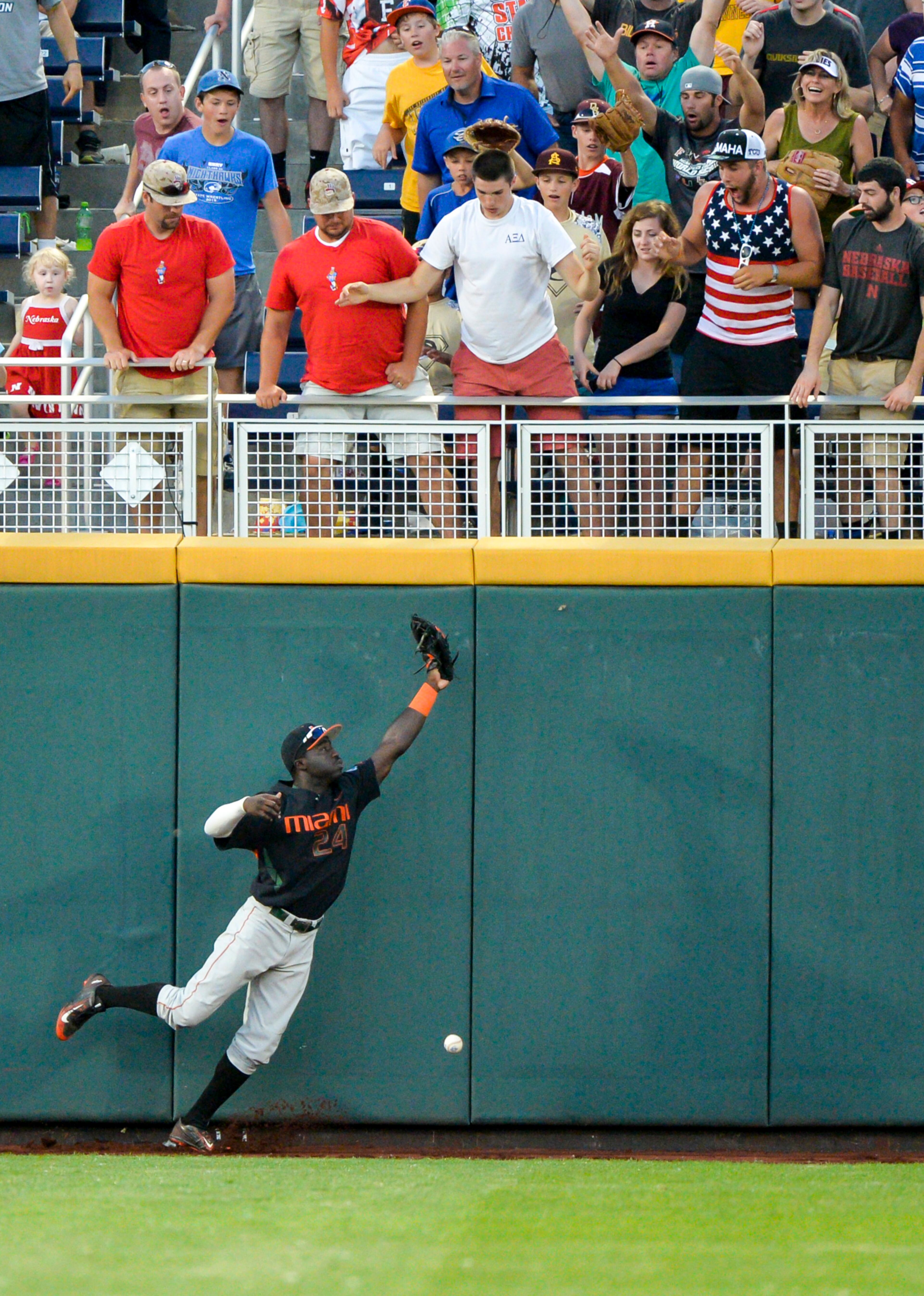 Miami left fielder Jacob Heyward can't corral a ball hit by Florida's Peter Alonso.