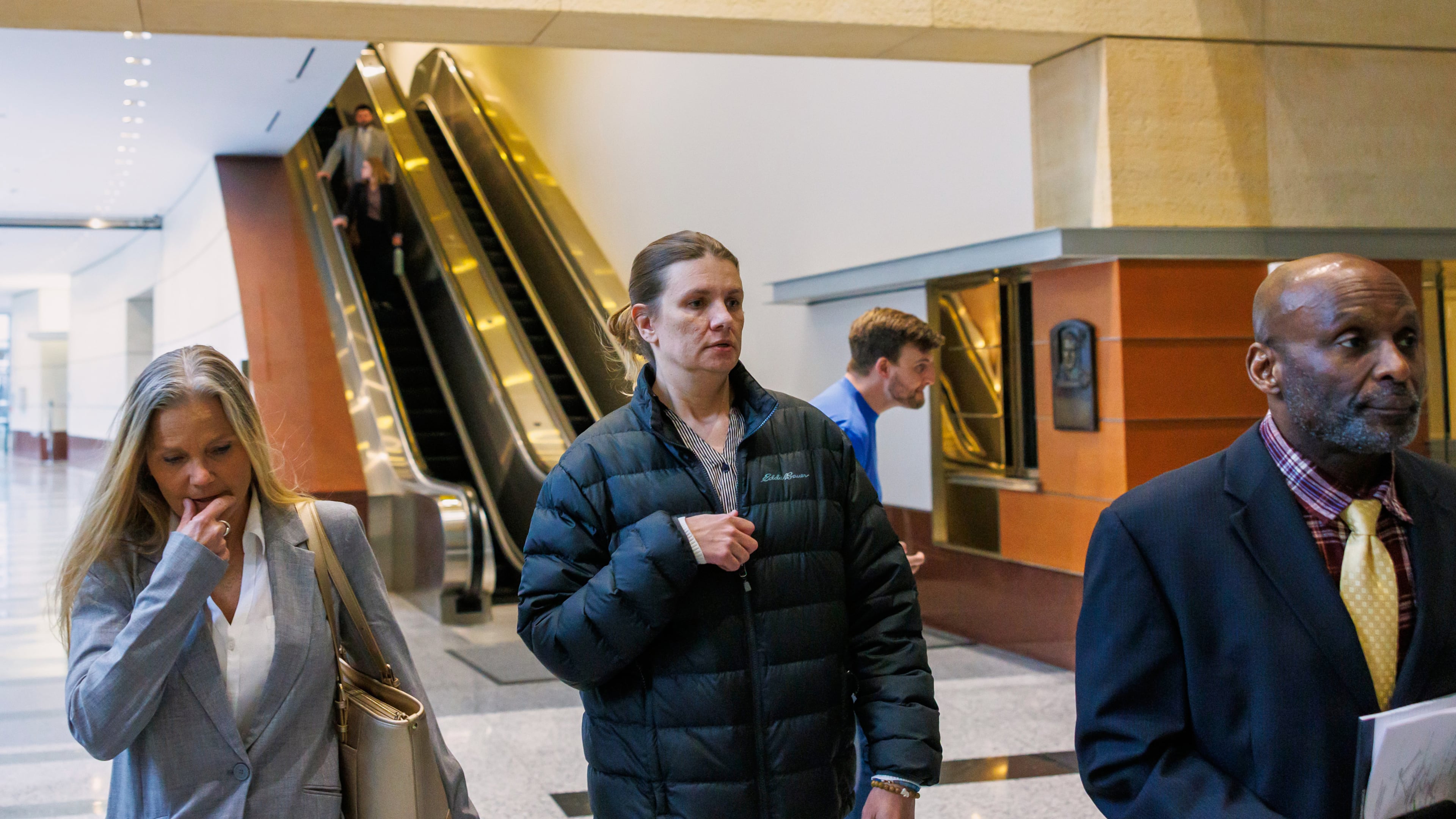 FILE - Aimee Bock, founder and executive director of the nonprofit organization Feeding Our Future, arrives at the Minneapolis federal courthouse with her attorney, Ken Udoibok, right, on March 19, 2025, in Minneapolis. (Kerem Yücel/Minnesota Public Radio via AP, File)