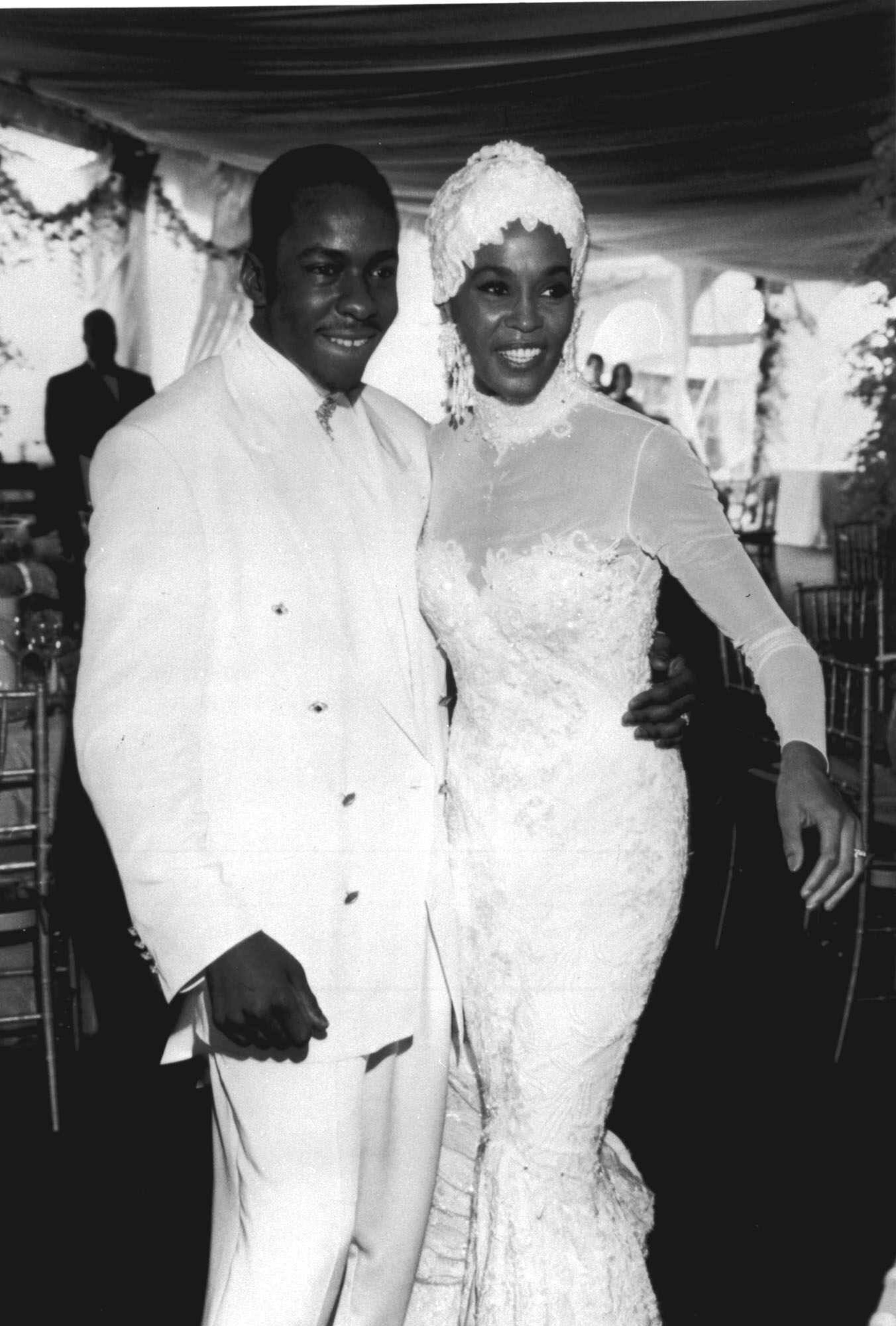 Singer Whitney Houston, right, is seen with her husband Bobby Brown during their wedding, in this 1992 photo. (AP Photo)