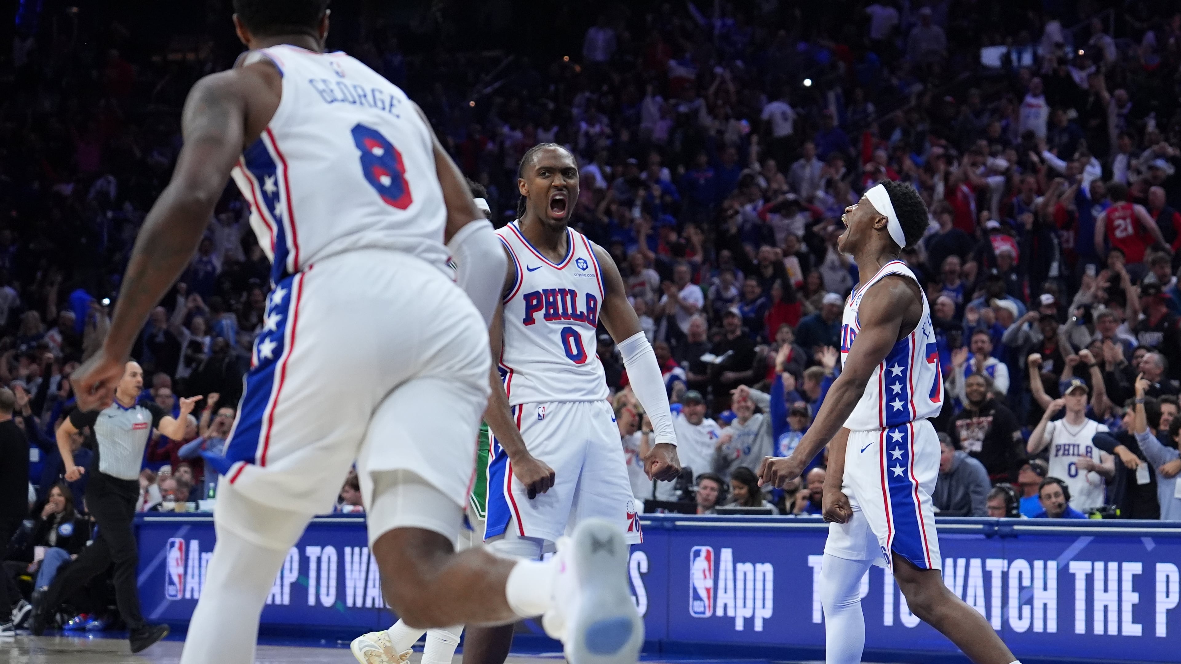 Philadelphia 76ers' Tyrese Maxey (0), Vj Edgecombe (77) and Paul George (8) celebrate during the second half of Game 6 in a first-round NBA basketball playoff series against the Boston Celtics Thursday, April 30, 2026, in Philadelphia. (AP Photo/Matt Slocum)