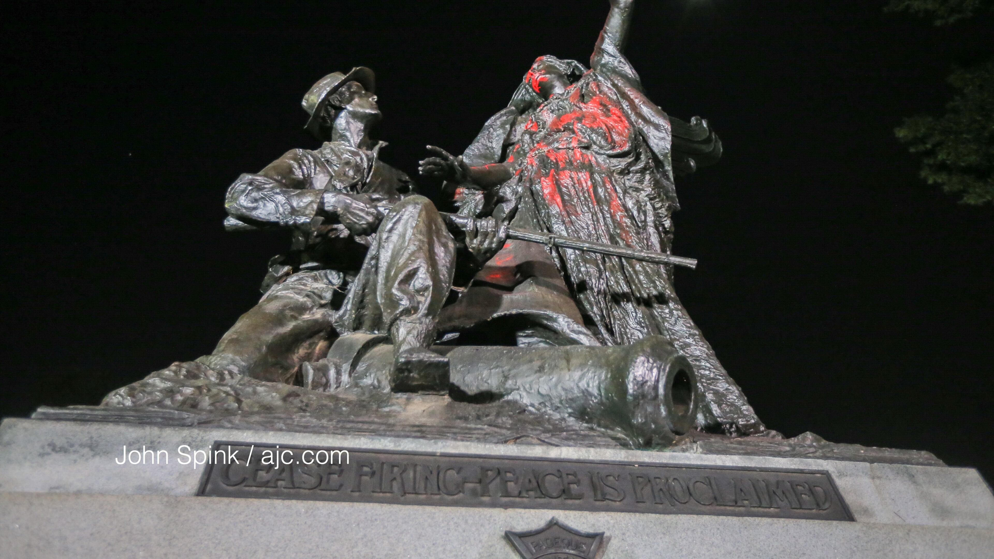 Protesters climbed the Peace Monument in Piedmont Park, spray painted it and tried tearing it down. The structure was erected in 1911 to champion unity and reconciliation. John Spink/AJC