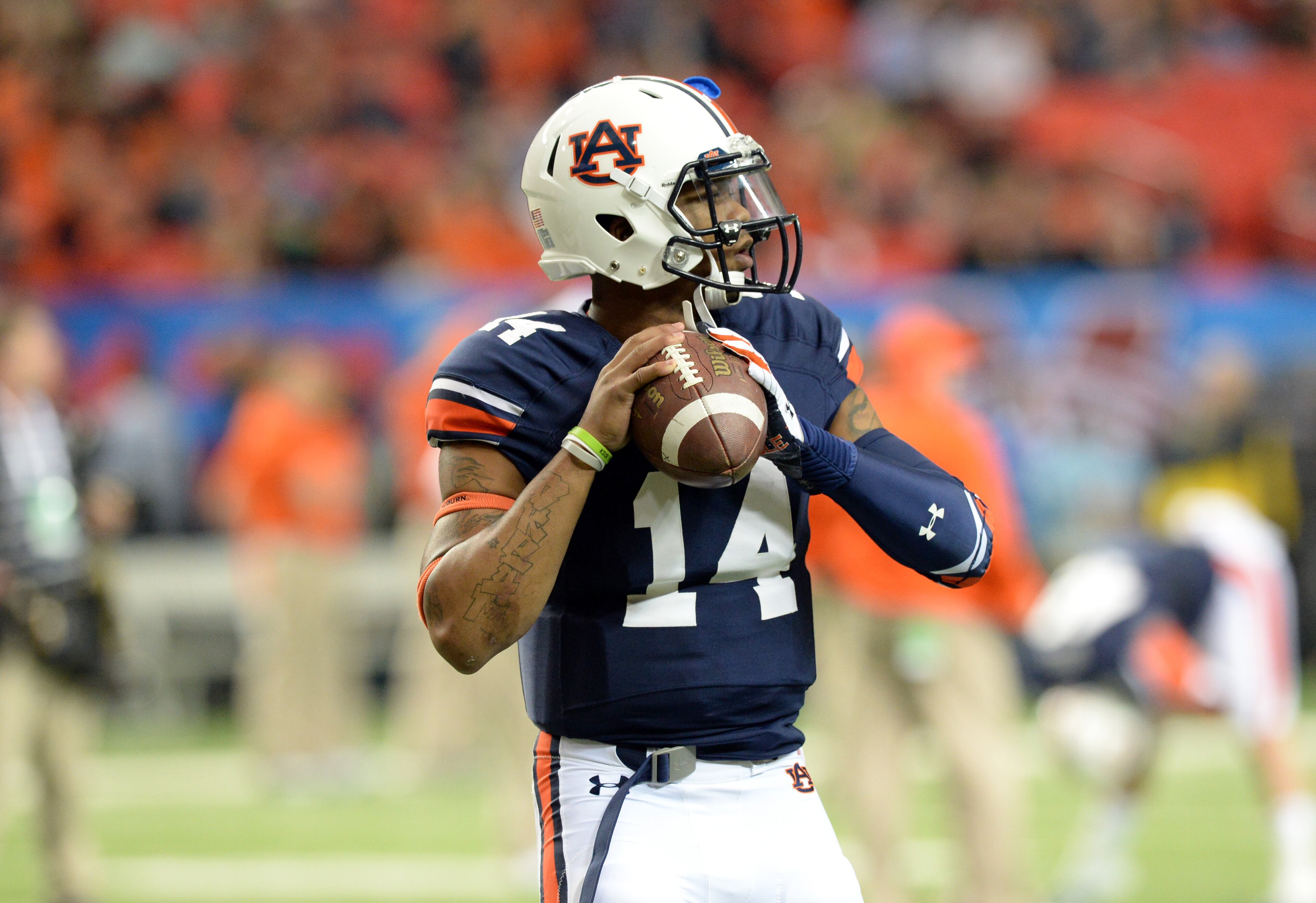 Auburn Tigers quarterback Nick Marshall (14) works out before the SEC Championship game against the Missouri Tigers at Georgia Dome on Saturday, December 7, 2013.