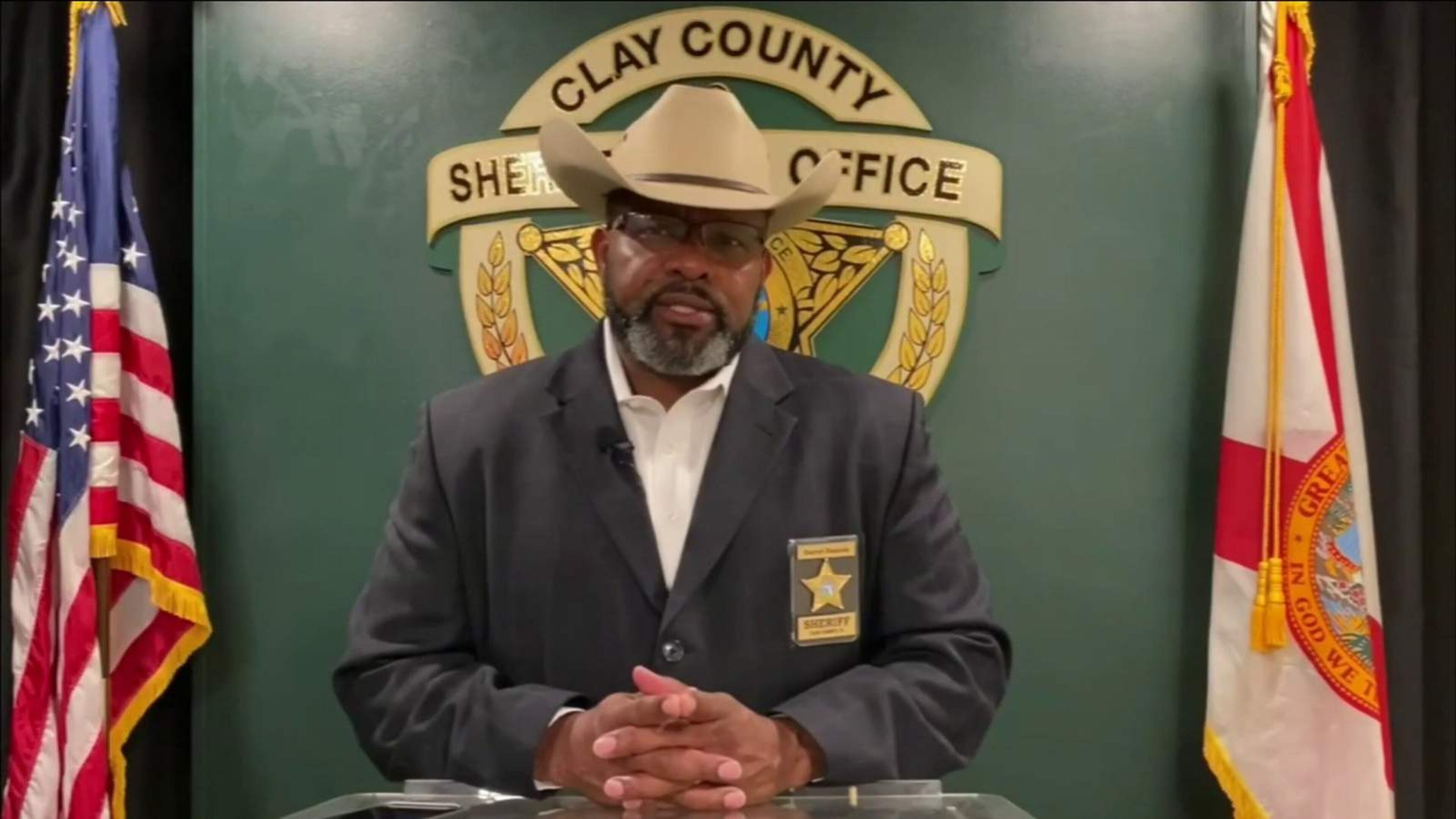 Clay County Sheriff Darryl Daniels surrendered to authorities Thursday at the Jacksonville jail and was booked on one felony charge of tampering with evidence and three misdemeanor counts of giving false information to law enforcement. The arrest happened only days away from Daniels' reelection primary.