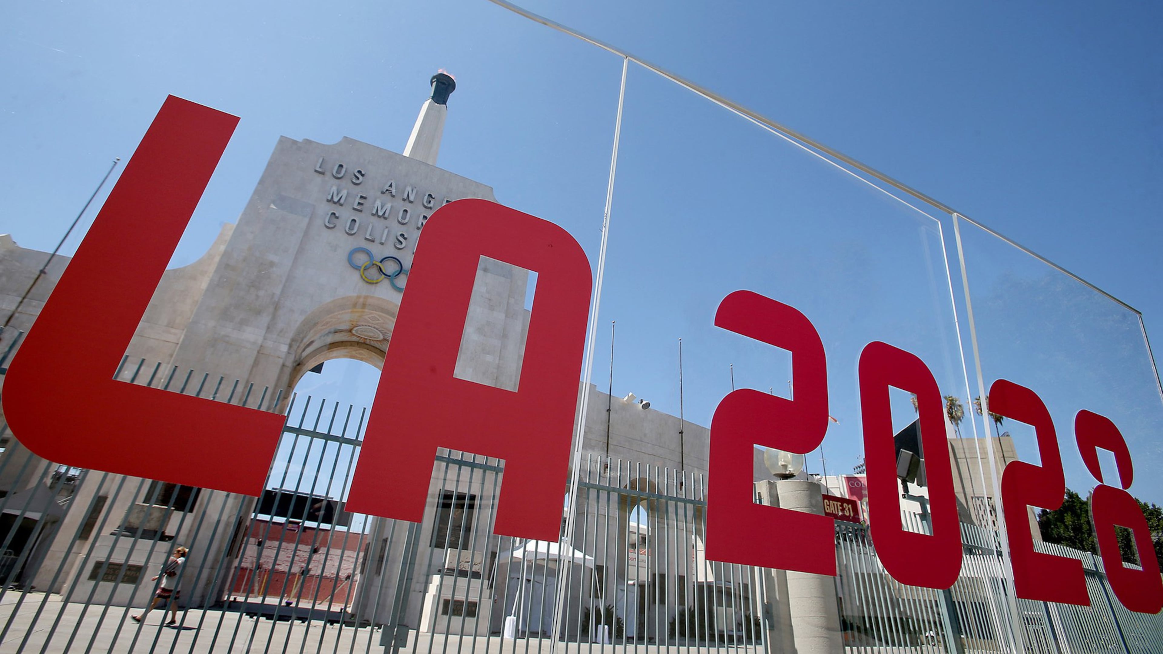 The Los Angeles Memorial Coliseum is framed by signage after the city was officially awarded the rights to host the 2028 Olympic Games on September 13, 2017. (Luis Sinco/Los Angeles Times/TNS)
