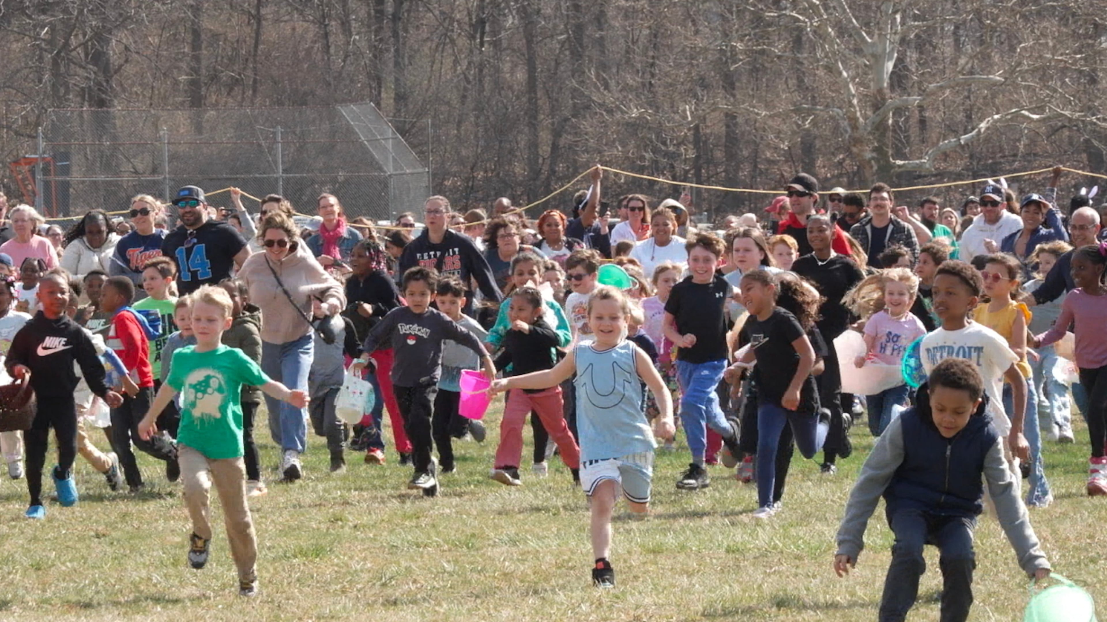 Children race to pick up marshmallows dropped from a helicopter during the annual Marshmallow Drop event held at Nankin Mills Park in Westland, Mich., on Friday, April 3, 2026. (AP Photo/Mike Householder)