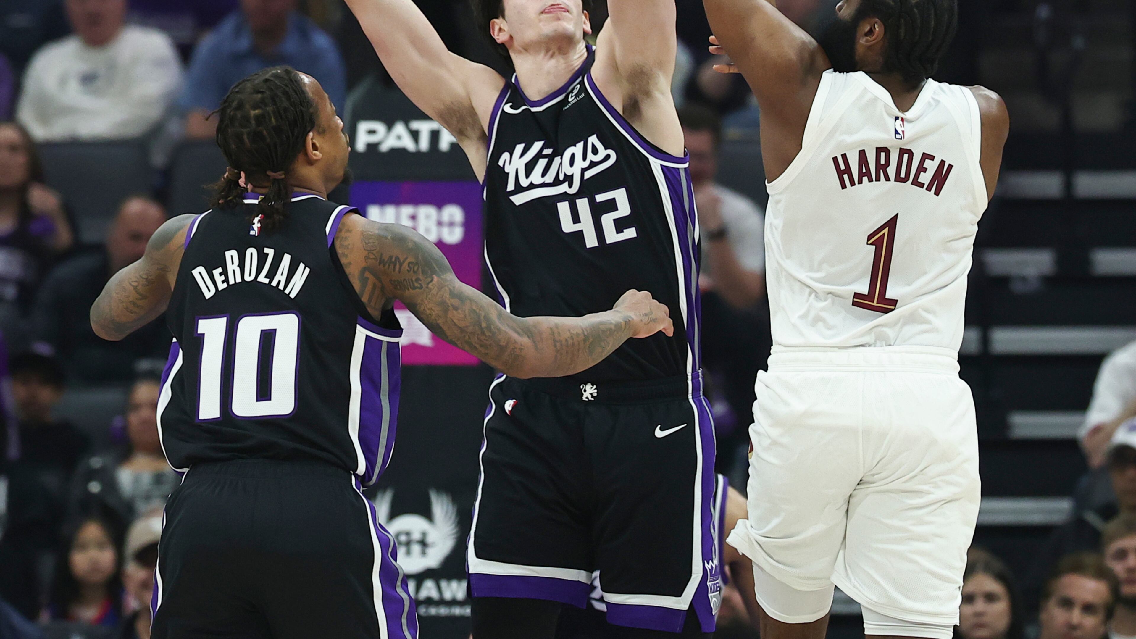 Cleveland Cavaliers guard James Harden (1) attempts to pass over Sacramento Kings center Maxime Raynaud (42) during the first half of an NBA basketball game Saturday, Feb. 7, 2026, in Sacramento, Calif. (AP Photo/Sara Nevis)